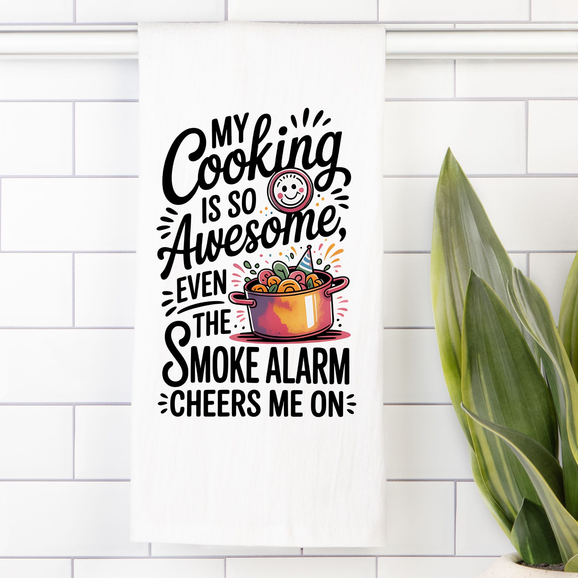 Decorative kitchen wall art with humorous quote and pot illustration on a white tiled wall.