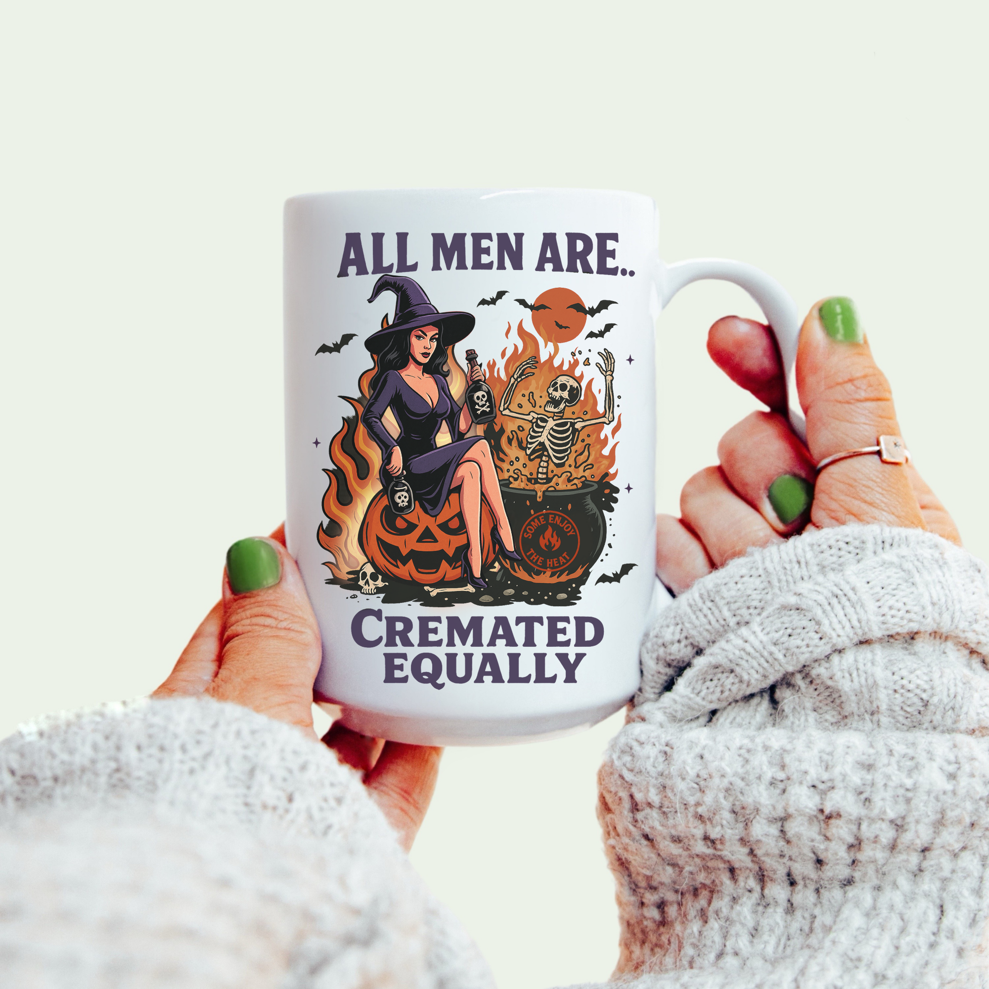 Mug with Halloween-themed design and text held by a person.