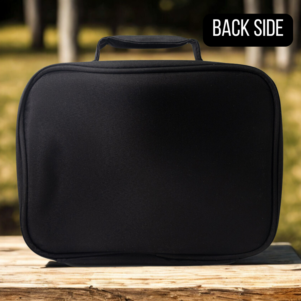 Black rectangular bag on a wooden surface with a blurred natural background
