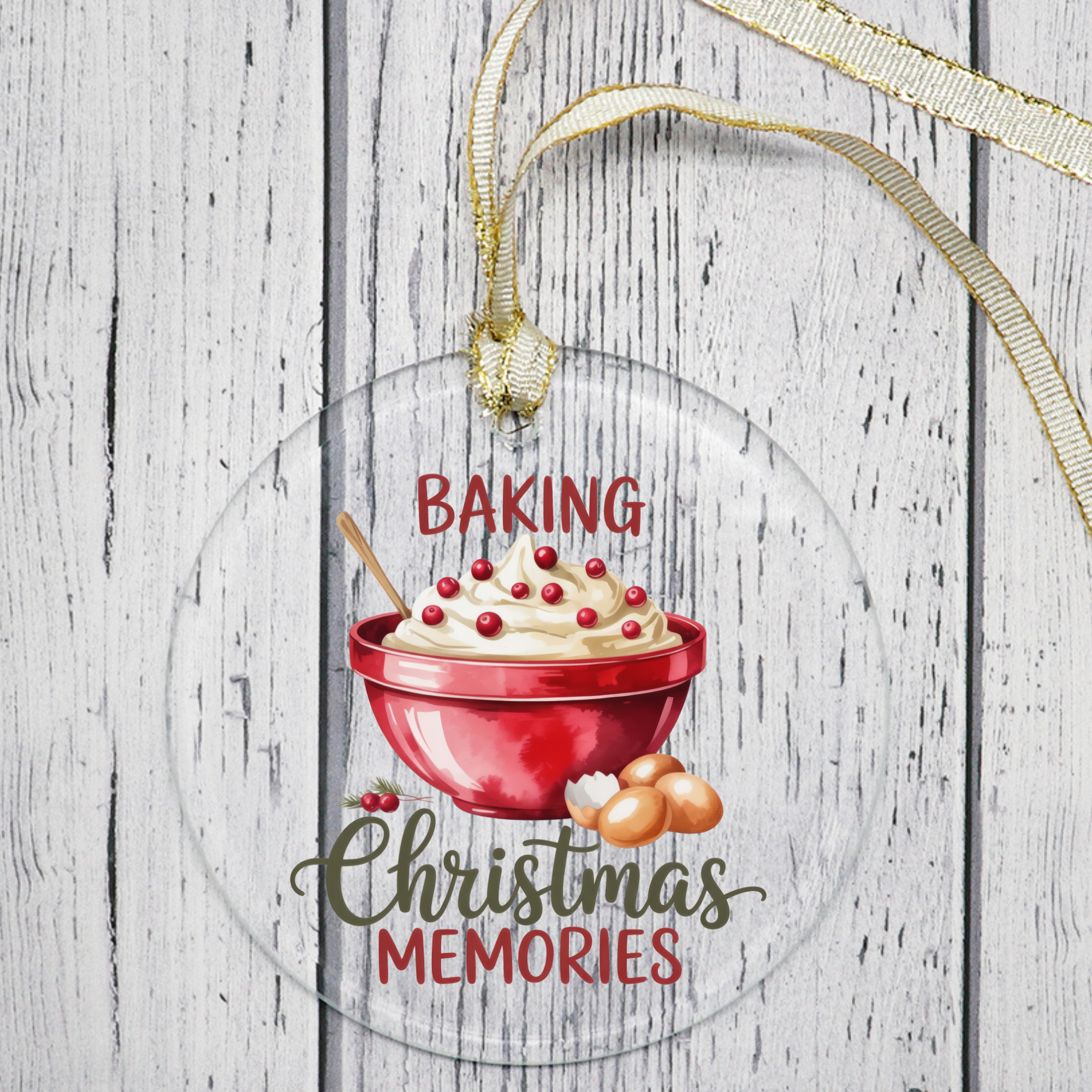 Decorative ornament with a red bowl of cookies, text 'Baking Christmas Memories', and gold ribbon on a wooden background.