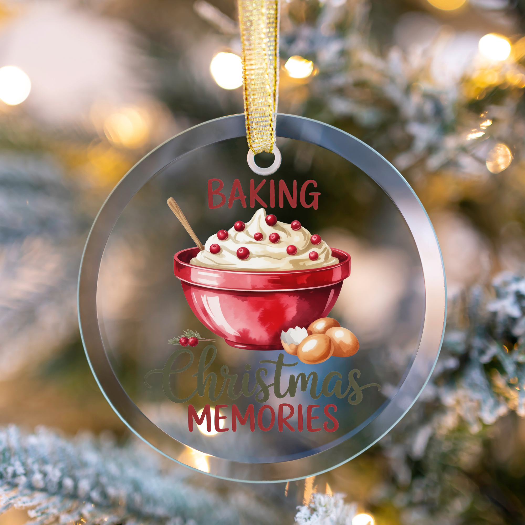 Decorative Christmas ornament with a bowl of cake and text 'Baking Christmas Memories' against a blurred Christmas tree background.