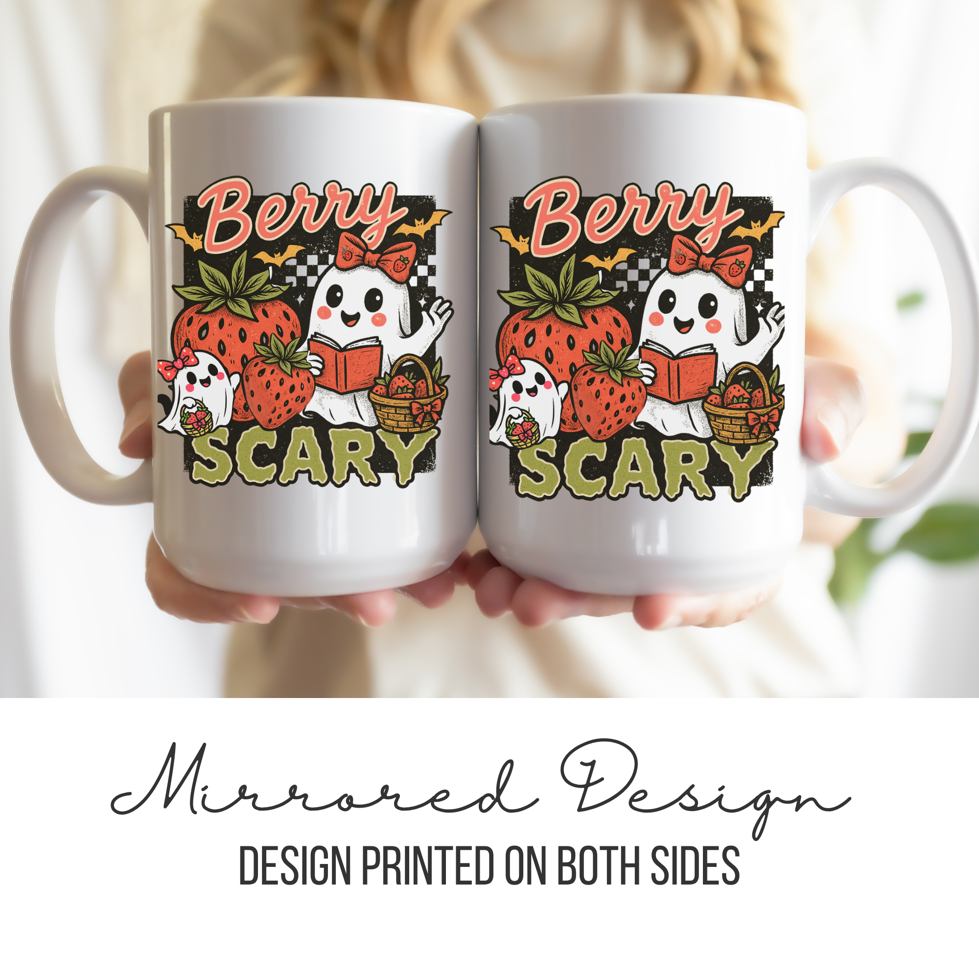 Two white mugs with a mirrored design of ghosts, strawberries, and text held together.