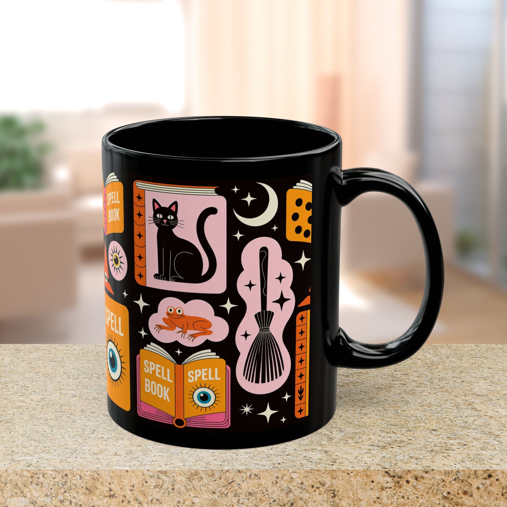 Black mug with colorful magic-themed design on a blurred indoor background