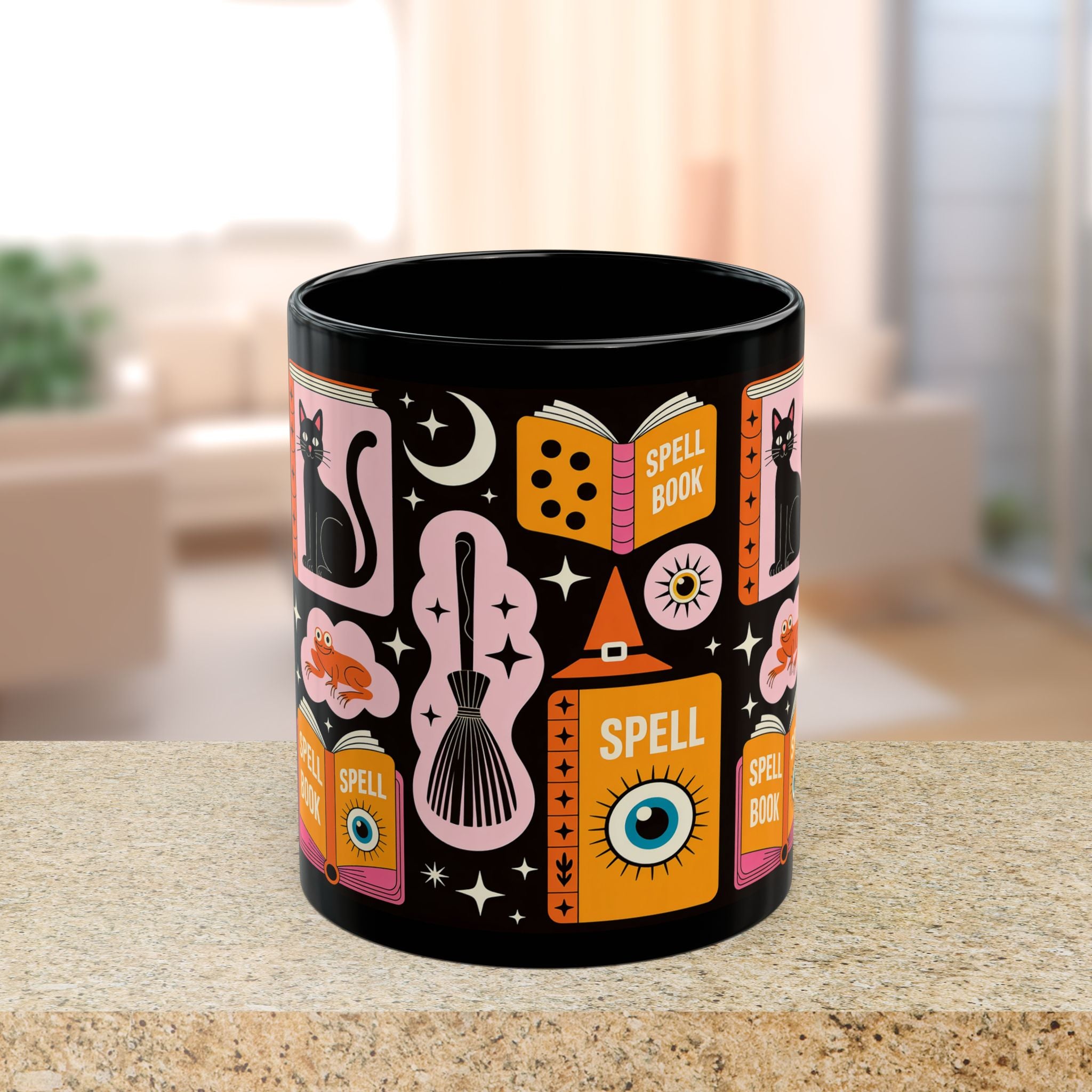 Black mug with colorful witch-themed design on a table