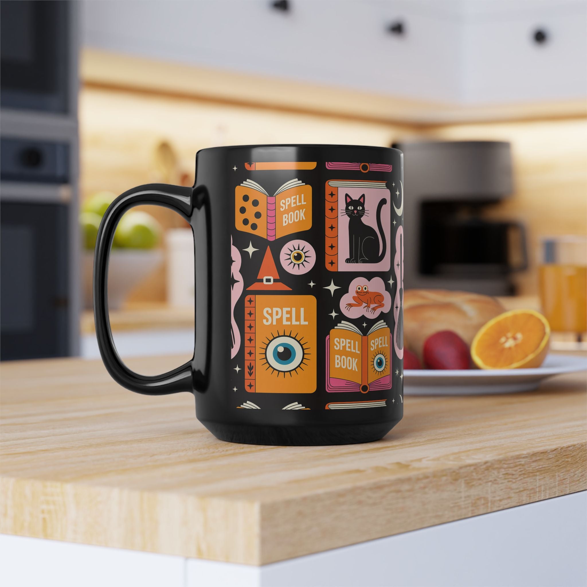 Black mug with colorful Halloween-themed design on a kitchen counter
