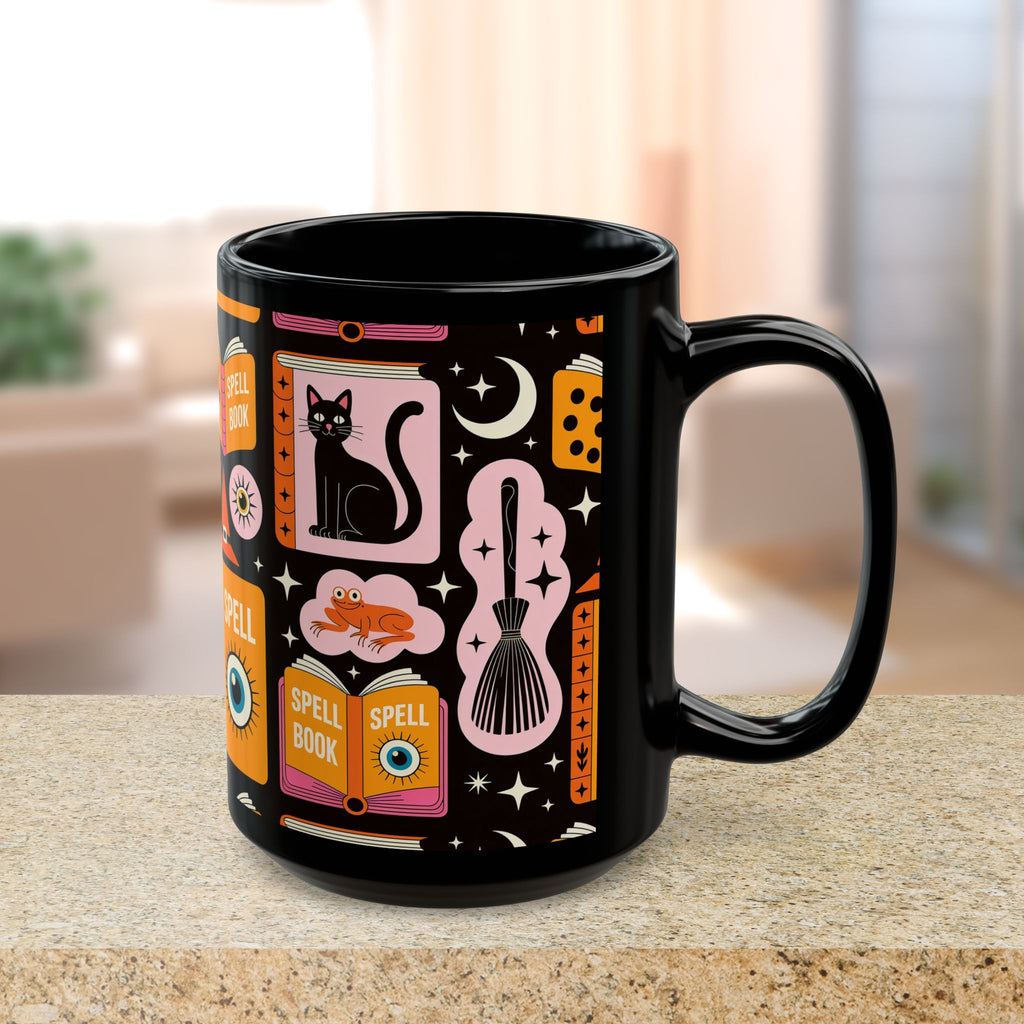 Black mug with colorful magic-themed design on a blurred indoor background