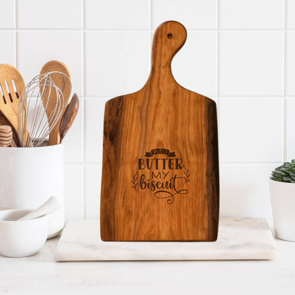 Wooden cutting board with engraved text on a kitchen counter