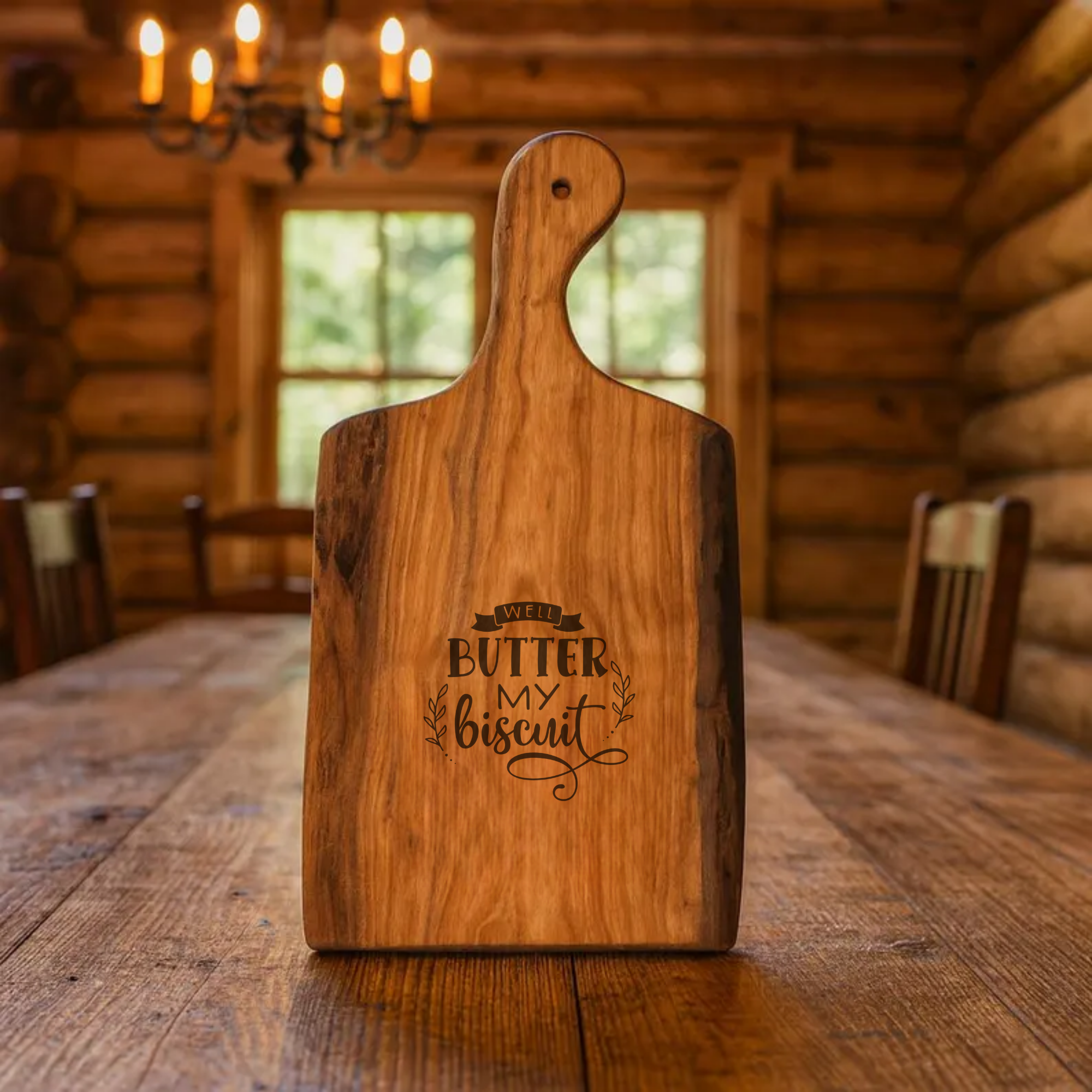 Wooden cutting board with engraved text on a wooden table in a rustic cabin setting