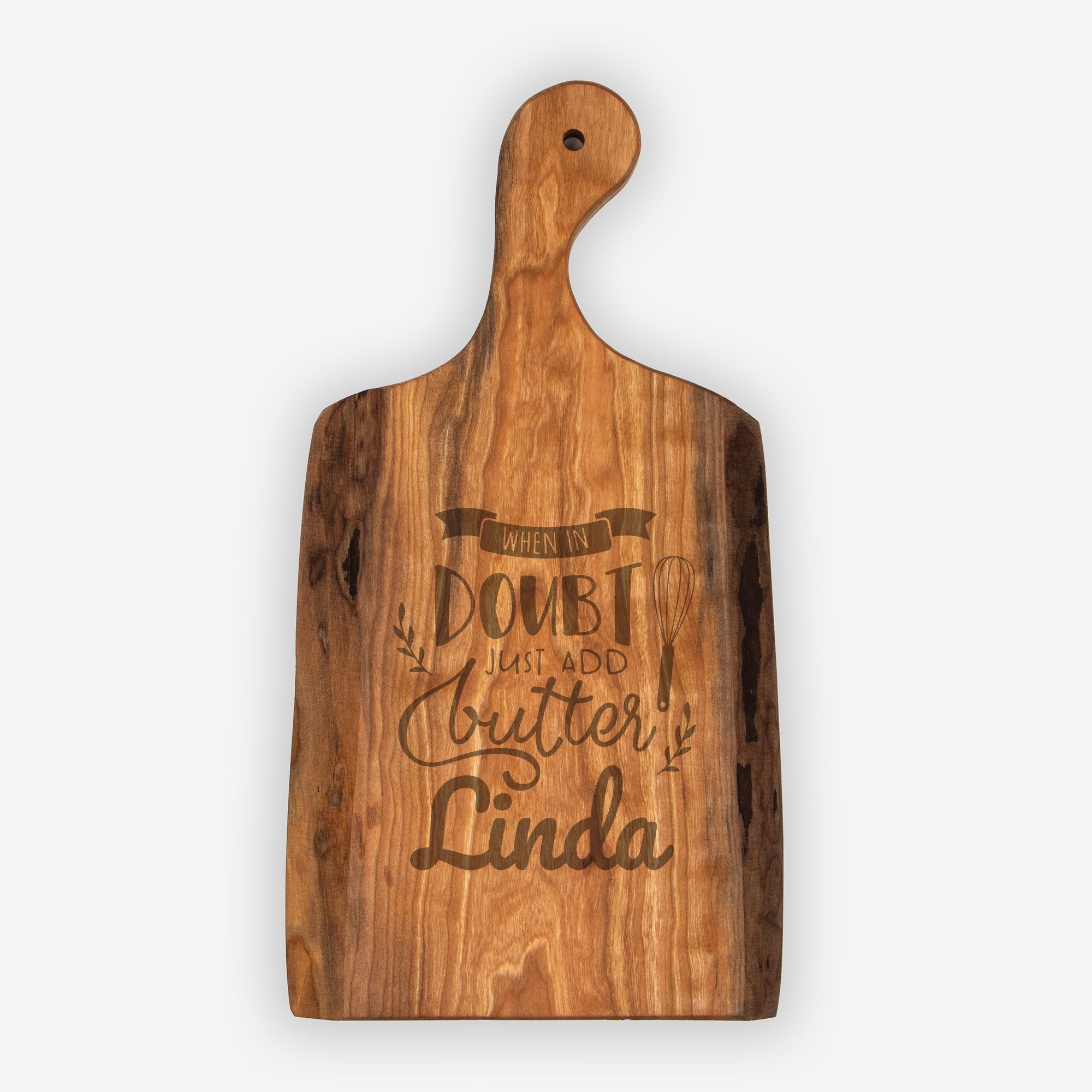 Wooden cutting board with engraved text on a white background
