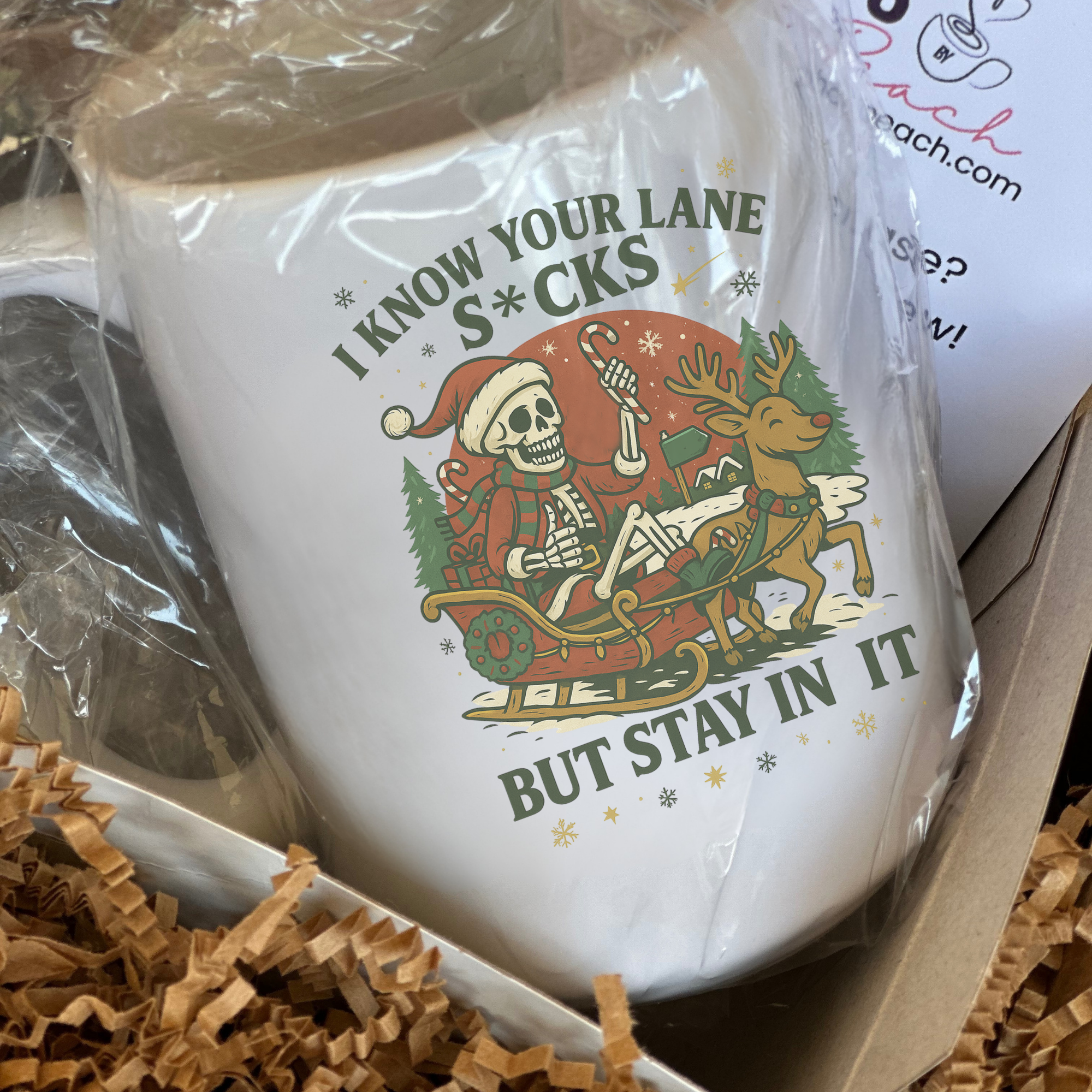 White mug with graphic design and text in a box