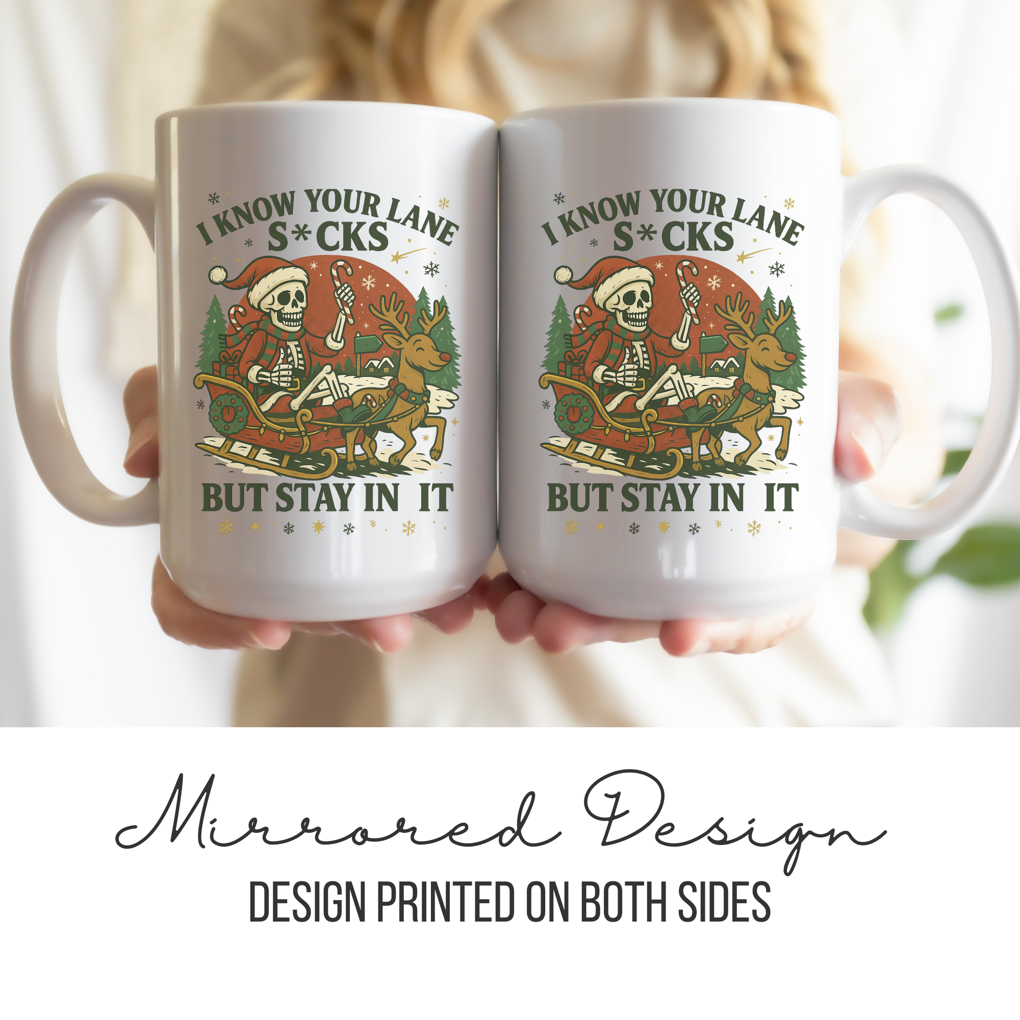 Two white mugs with a mirrored design featuring a skeleton, reindeer, and text.