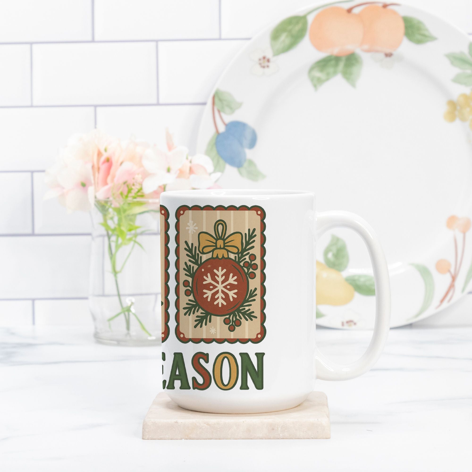 Mug with decorative design and text on a white surface with a blurred background
