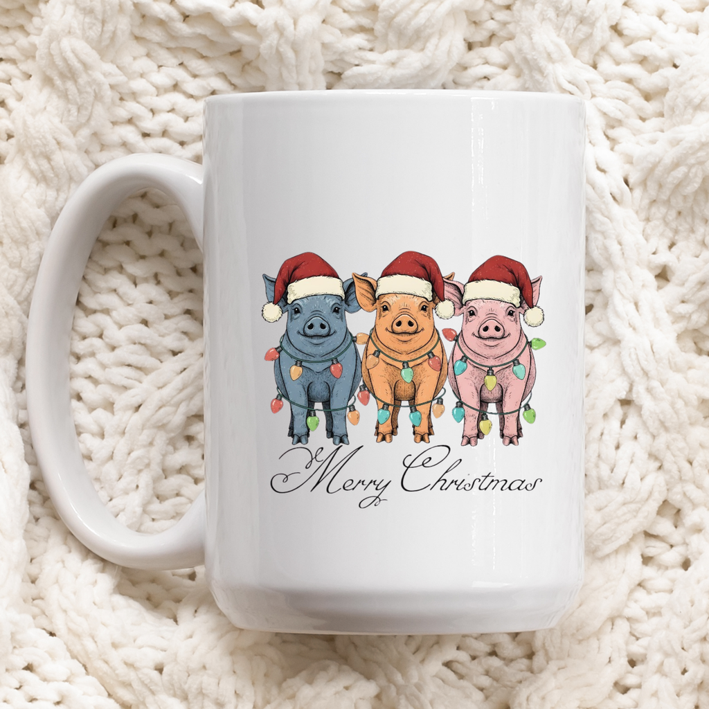 White mug with Christmas-themed design of pigs wearing Santa hats and lights on a white textured background