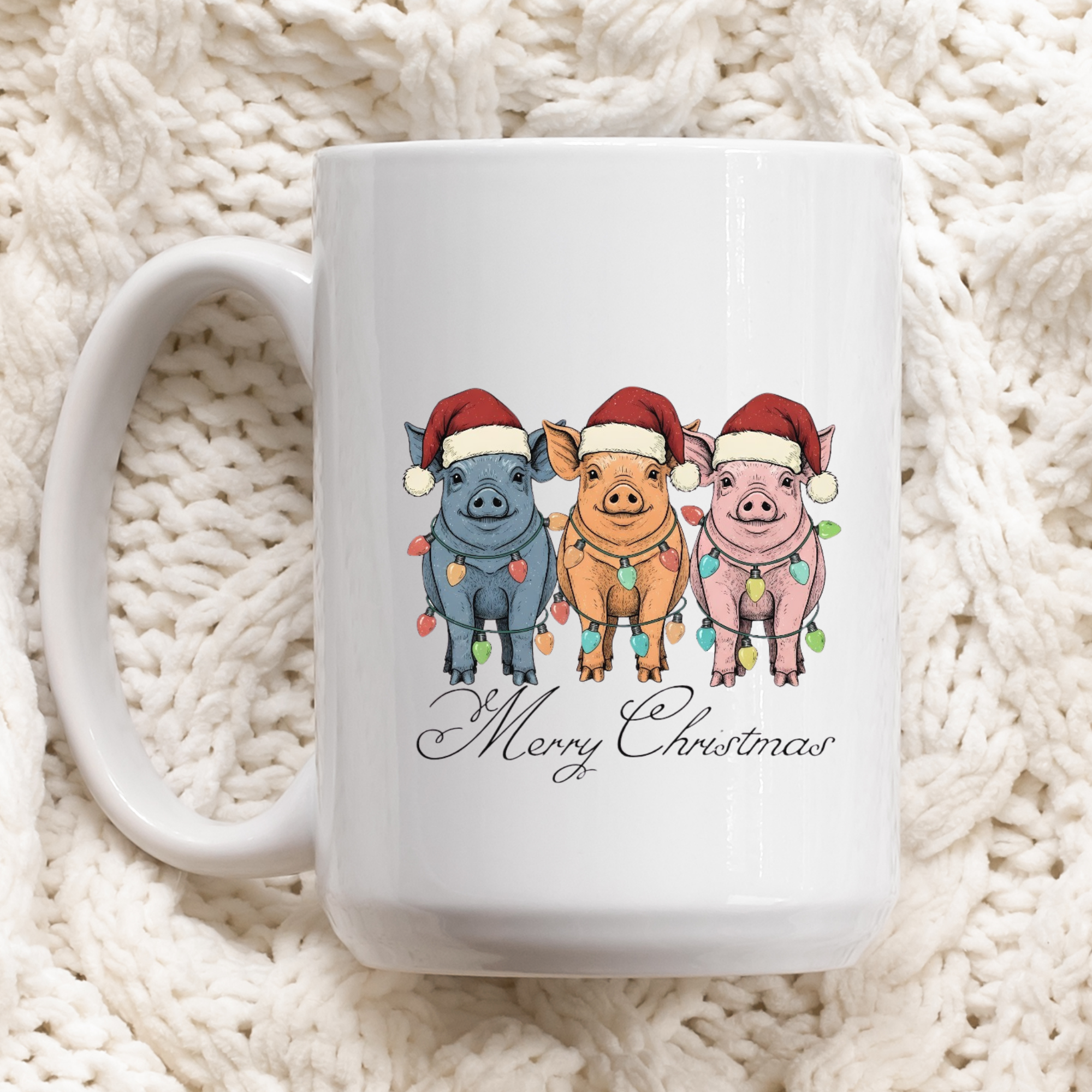 White mug with Christmas-themed design of pigs wearing Santa hats and lights on a white textured background