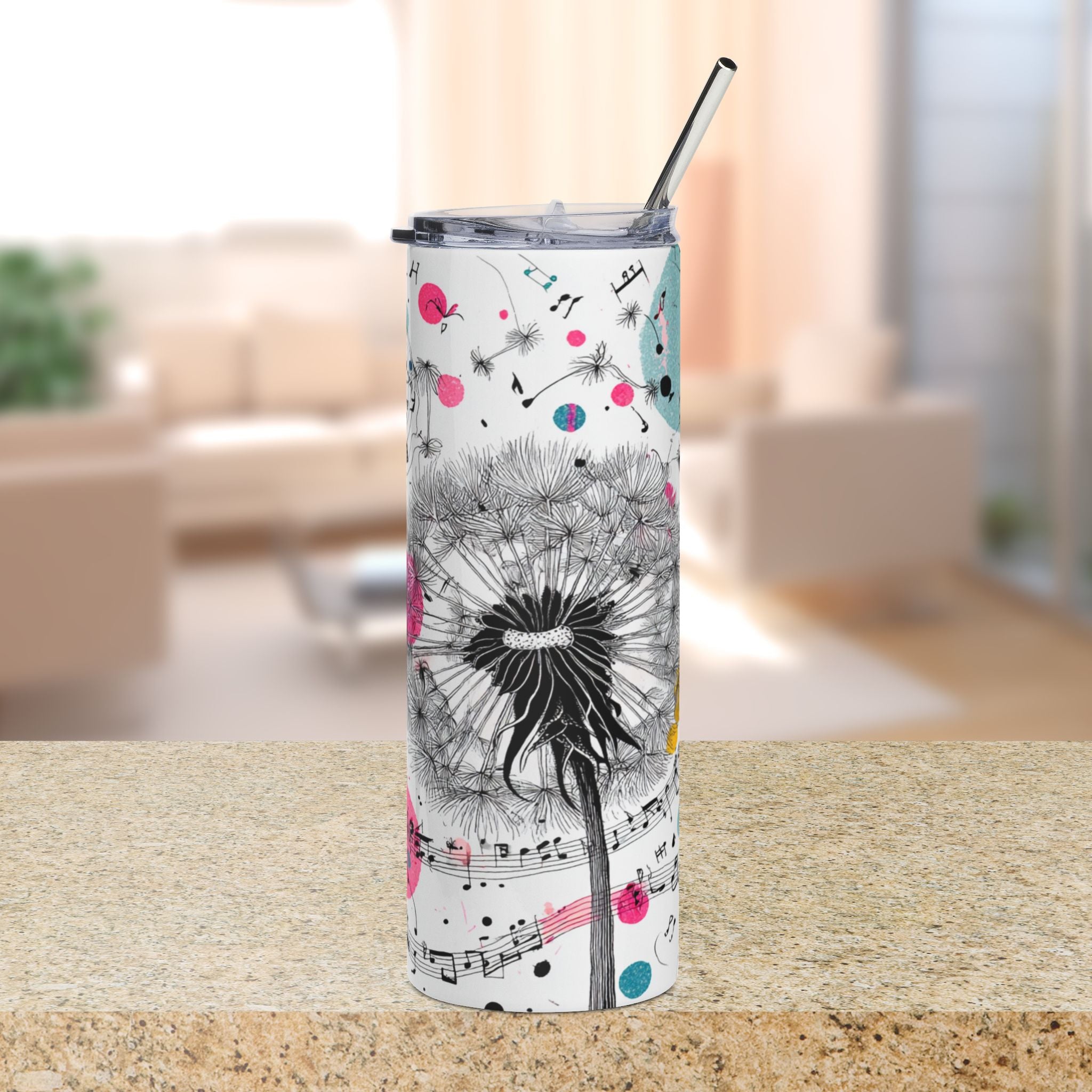 Tumbler with dandelion and musical note design on a countertop