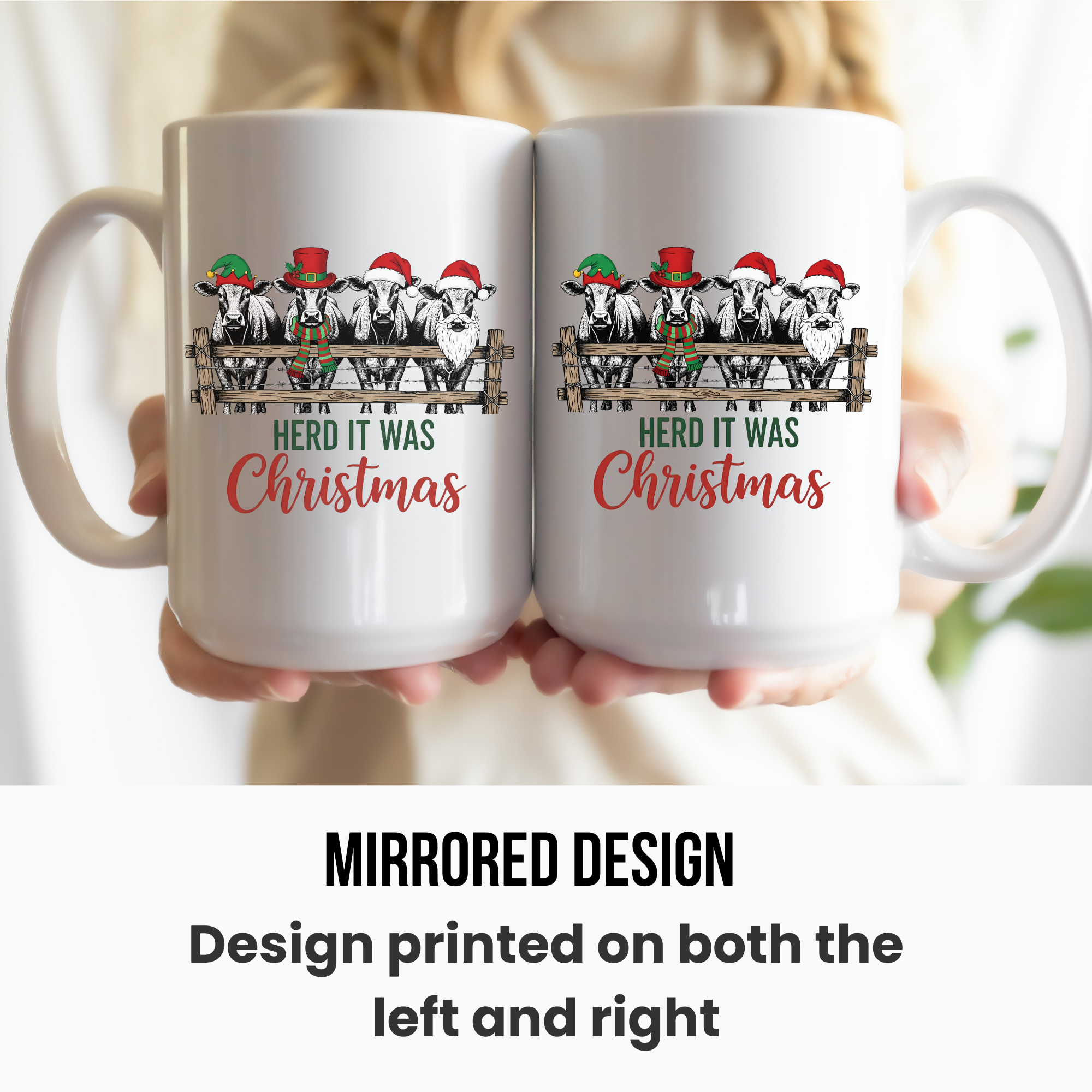 Two white mugs with a mirrored Christmas design held by a person.