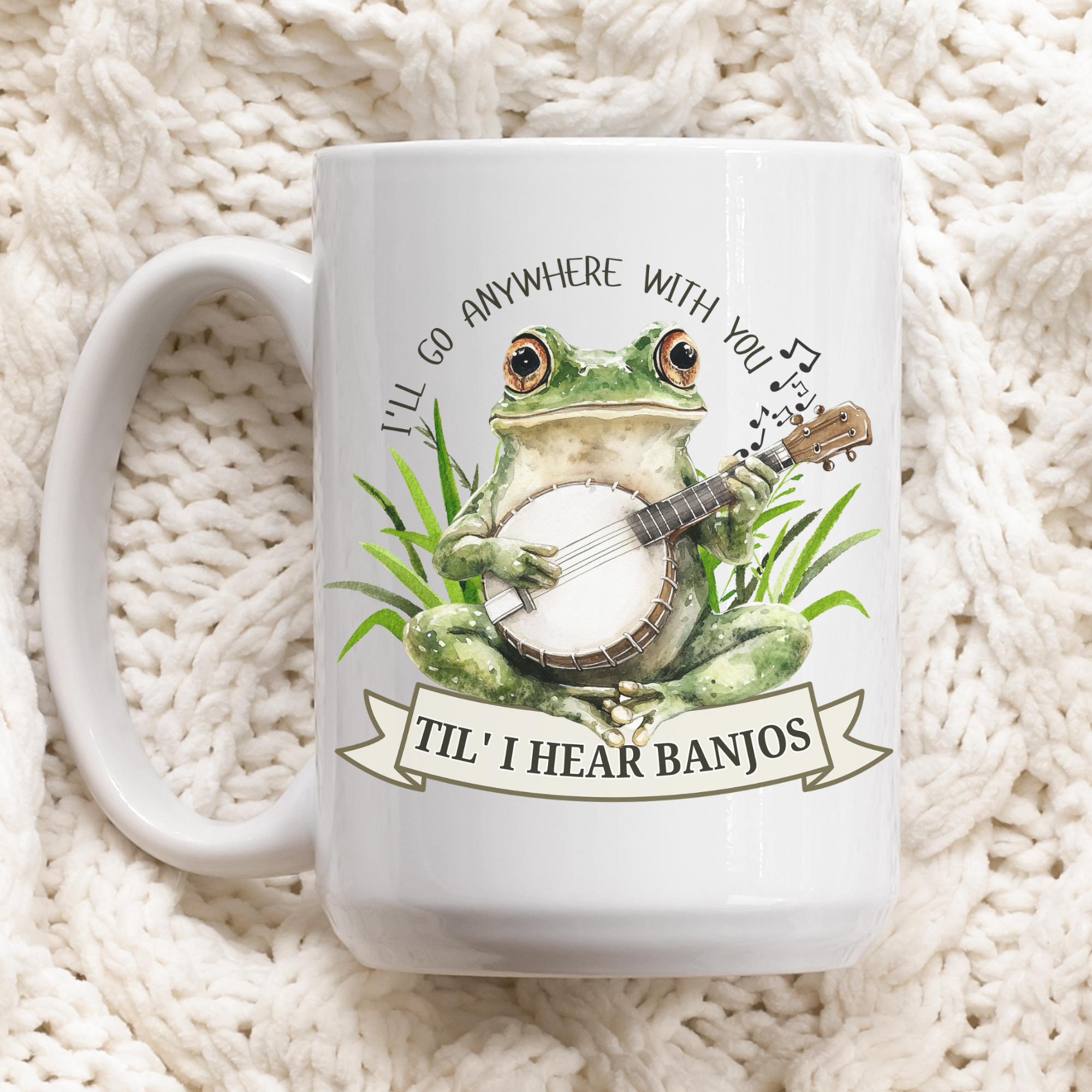 White mug with a frog playing banjo design on a textured white background