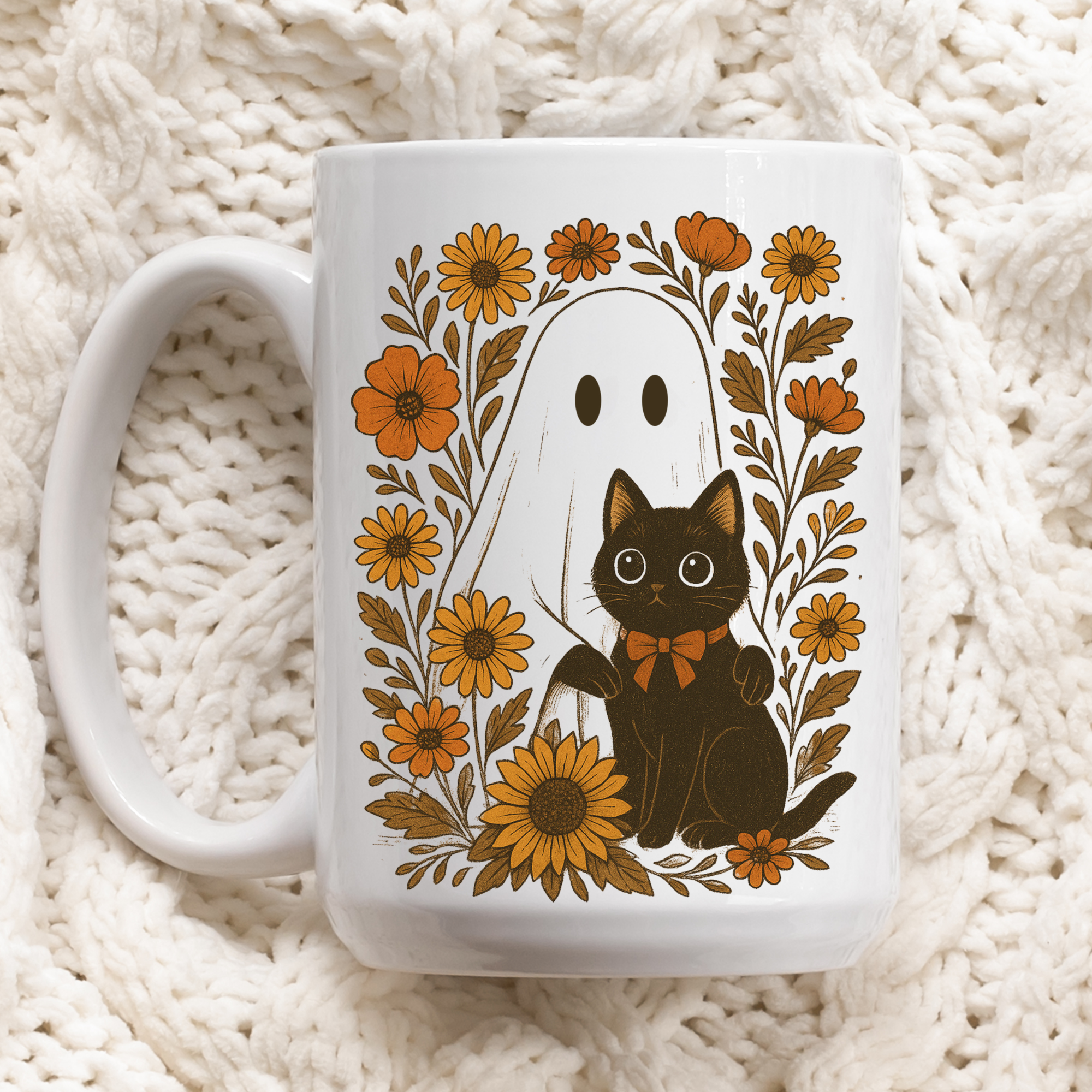White mug with a black cat and ghost design on a textured white background