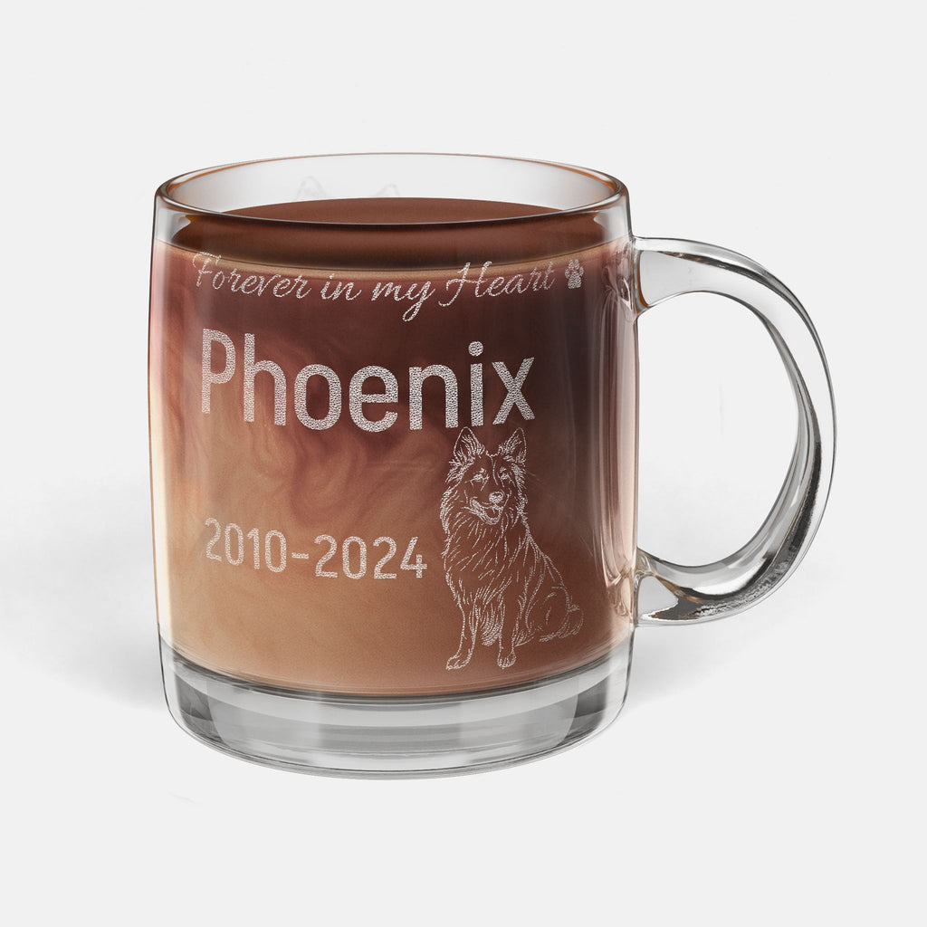 Glass mug with engraved text and a Belgian Shepherd dog illustration, filled with hot chocolate.