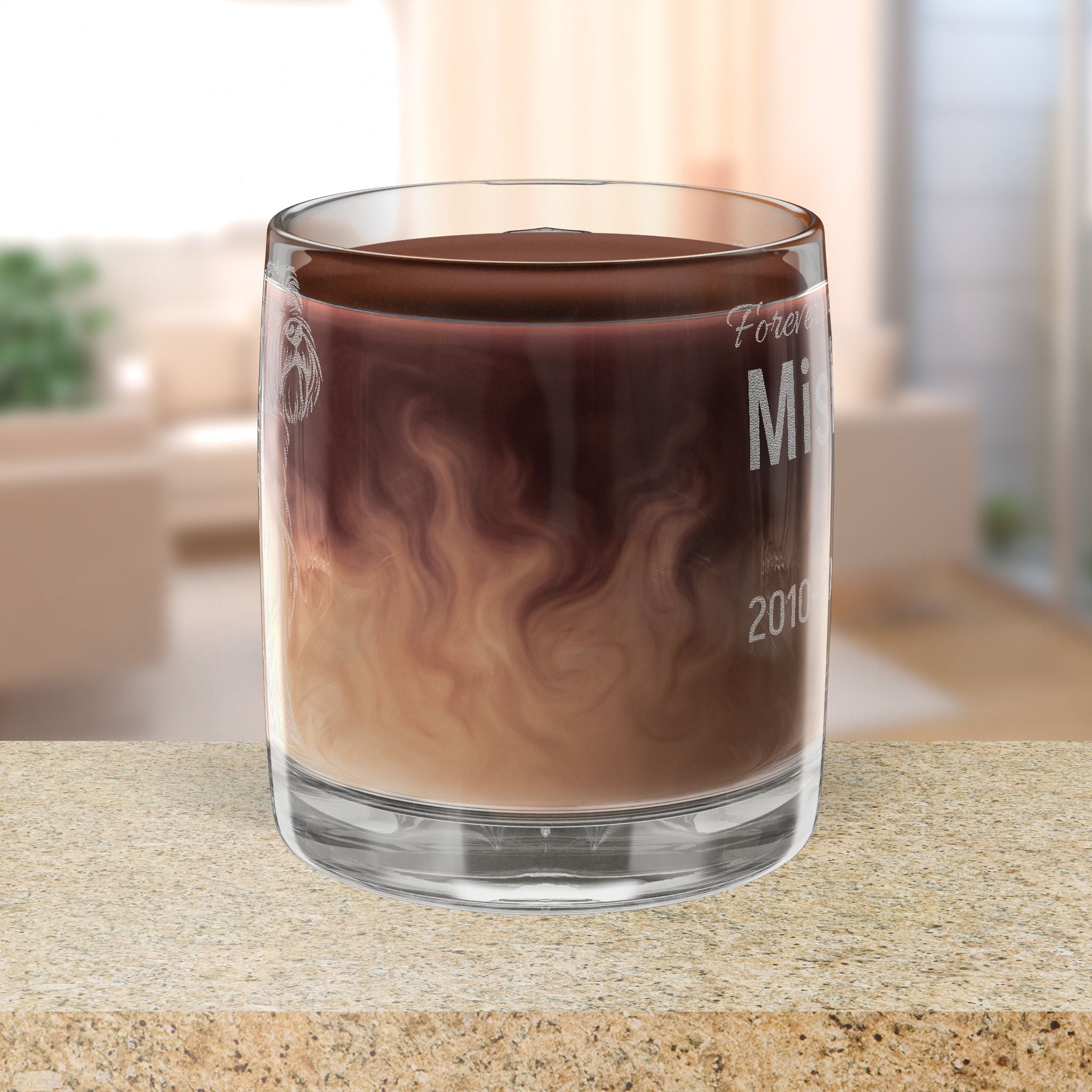 Glass Mug of hot chocolate with a blurred indoor background