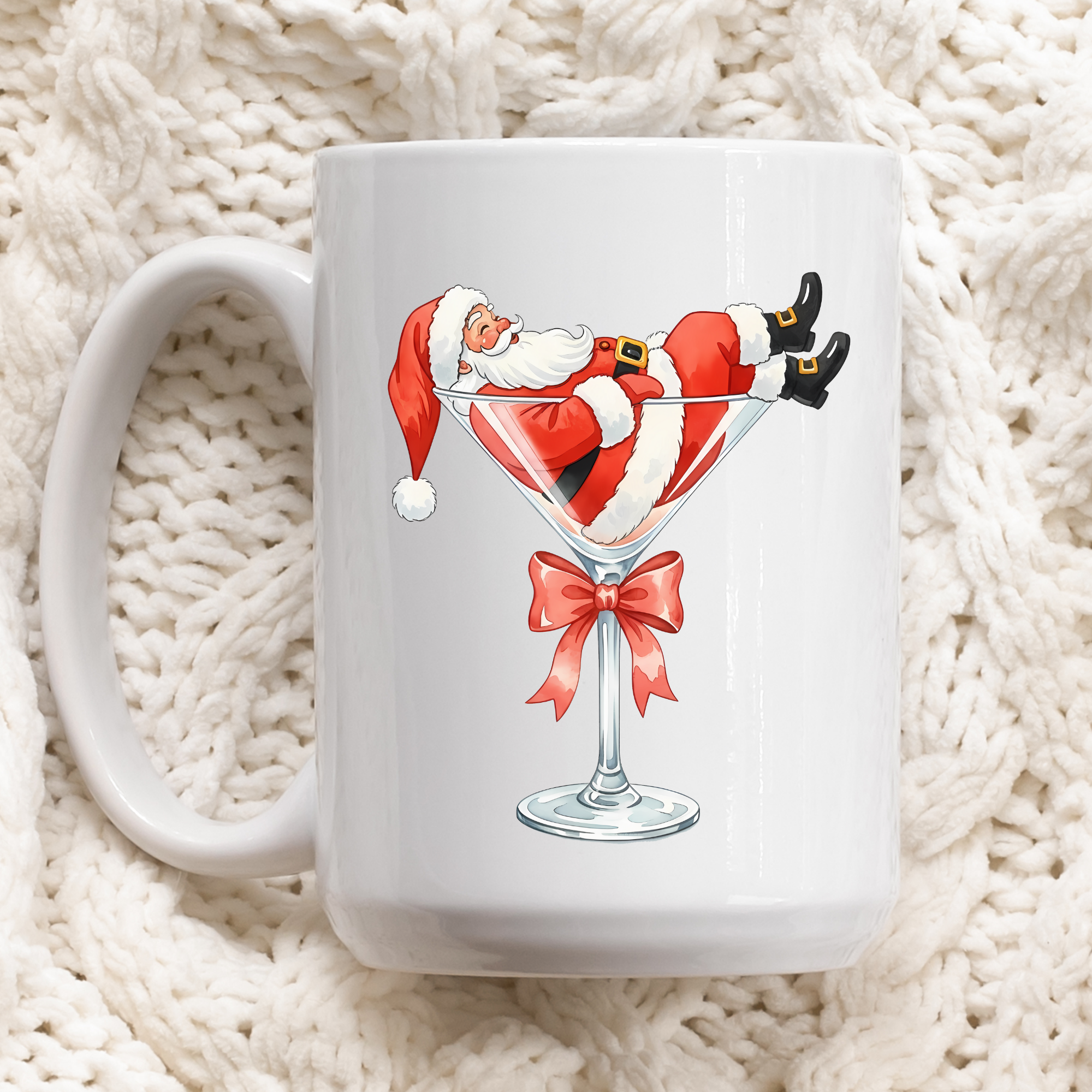 White mug with a design of Santa Claus in a martini glass on a white textured background