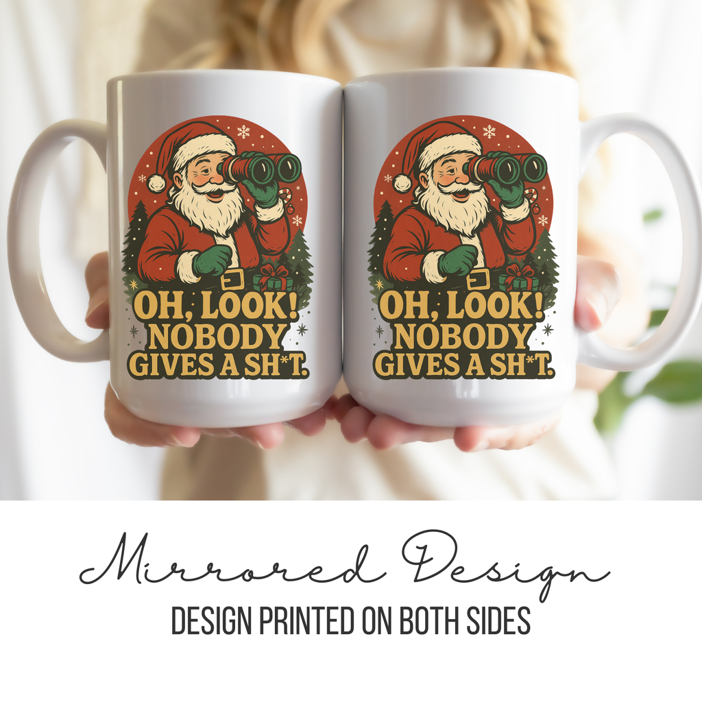 Two white mugs with a mirrored design of Santa Claus and text, held together.