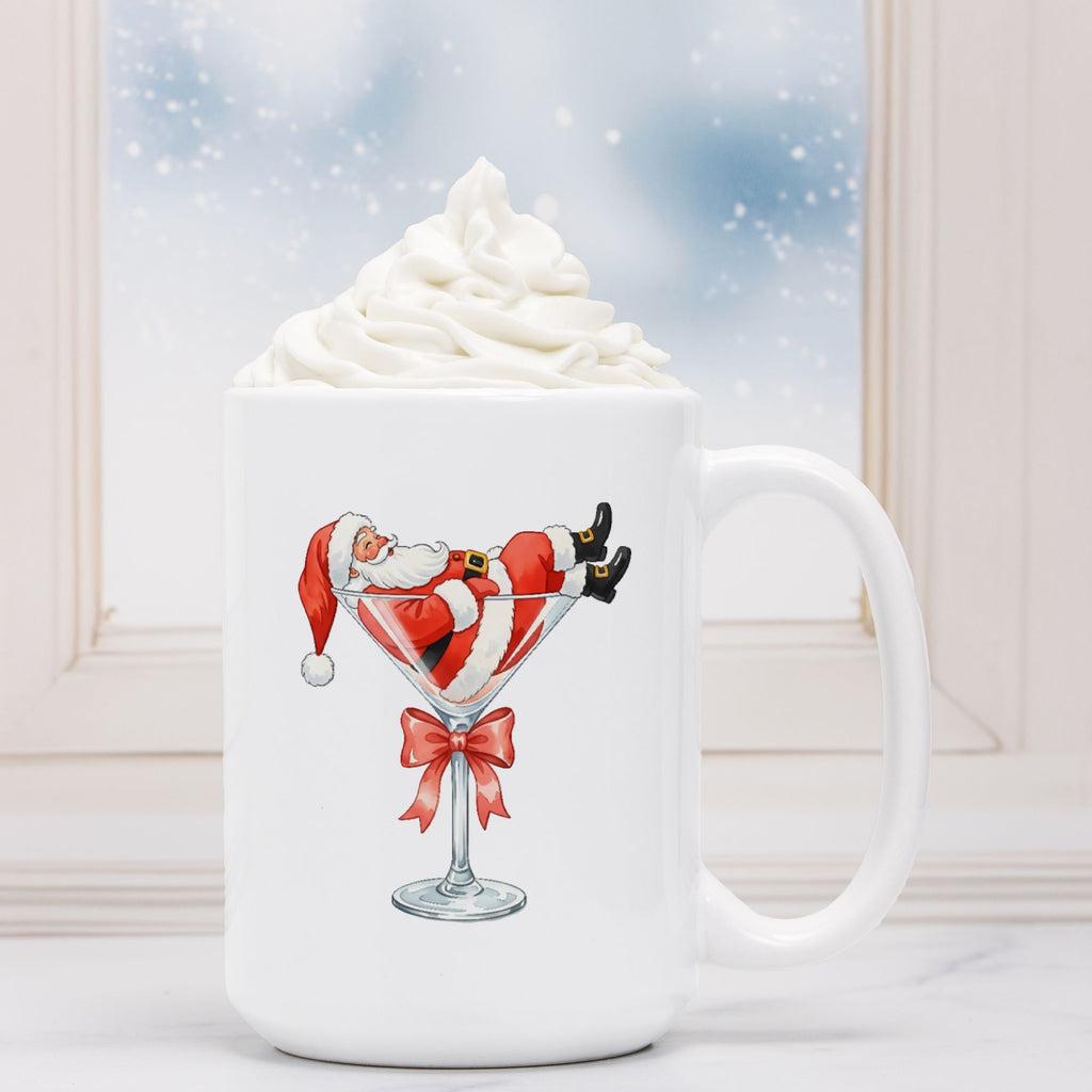White mug with a design of Santa Claus in a martini glass against a snowy window background