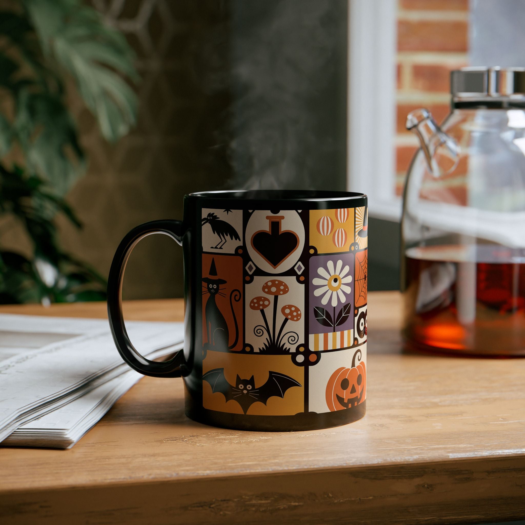 Decorative mug with Halloween-themed design on a wooden table.