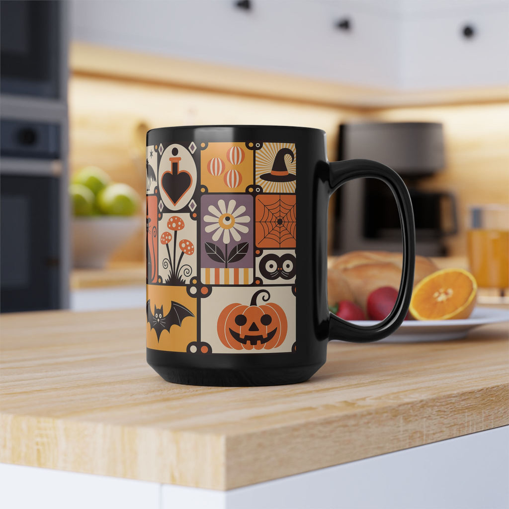 Black mug with Halloween-themed design on a kitchen counter