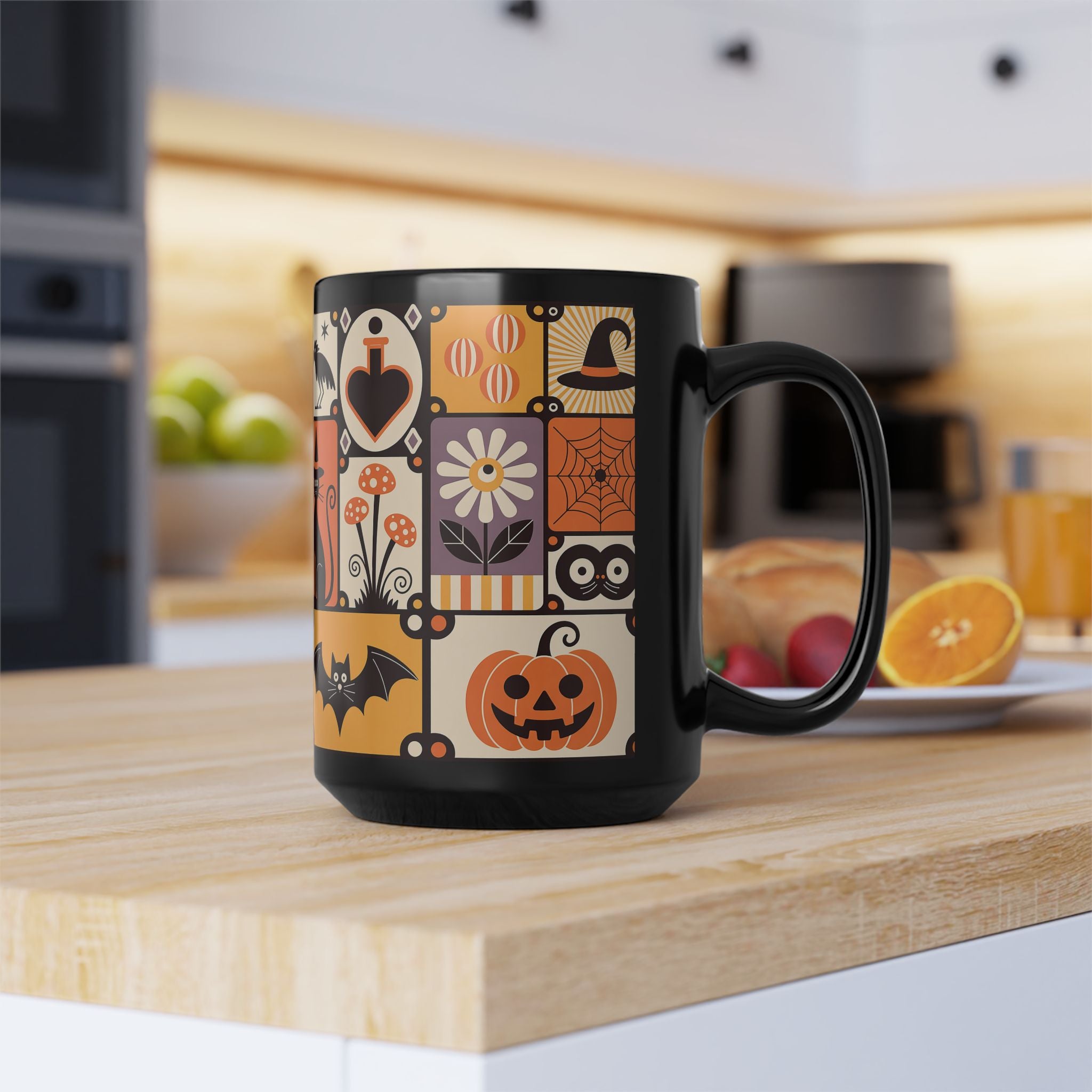 Black mug with Halloween-themed design on a kitchen counter