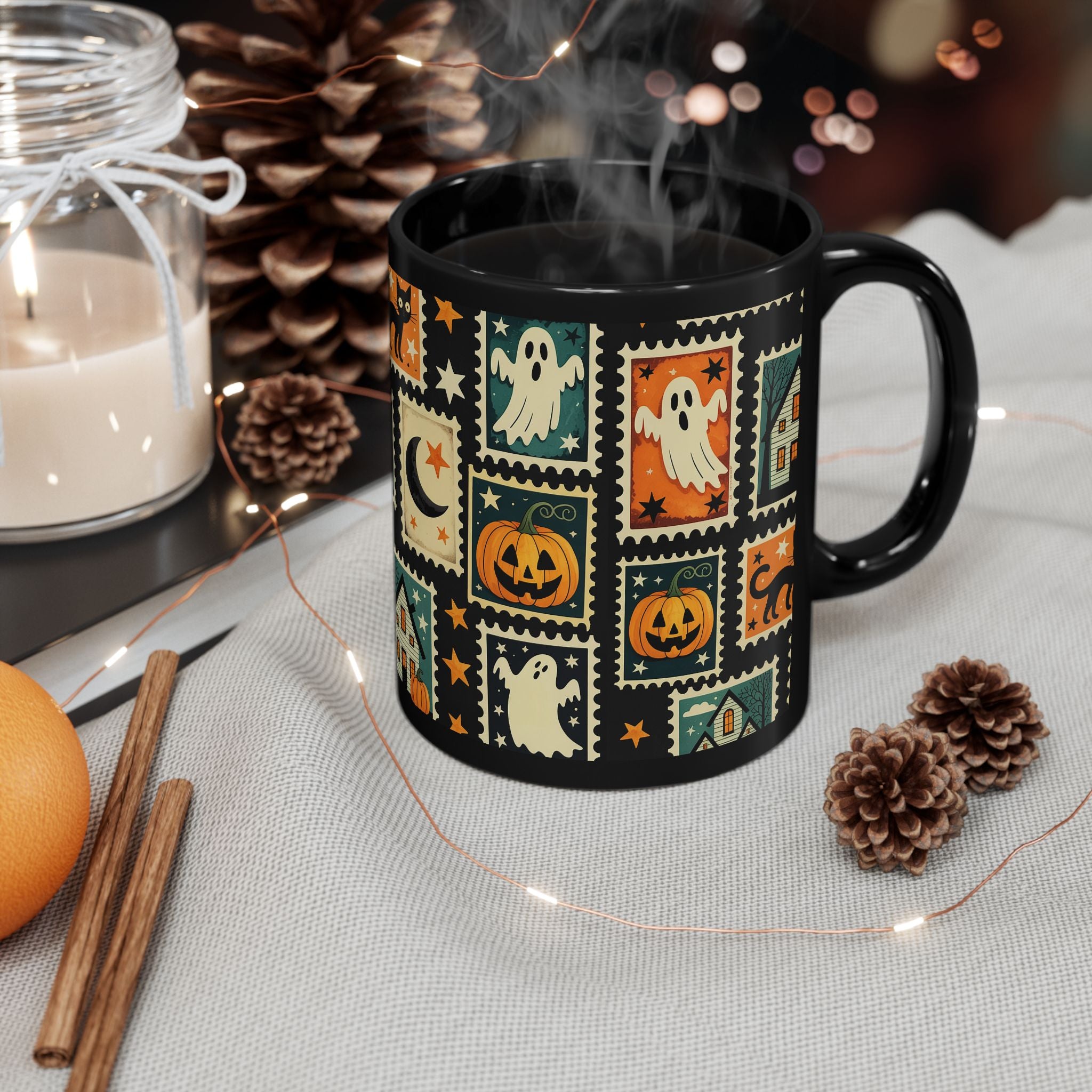 Black mug with Halloween-themed design on a table with decorative items