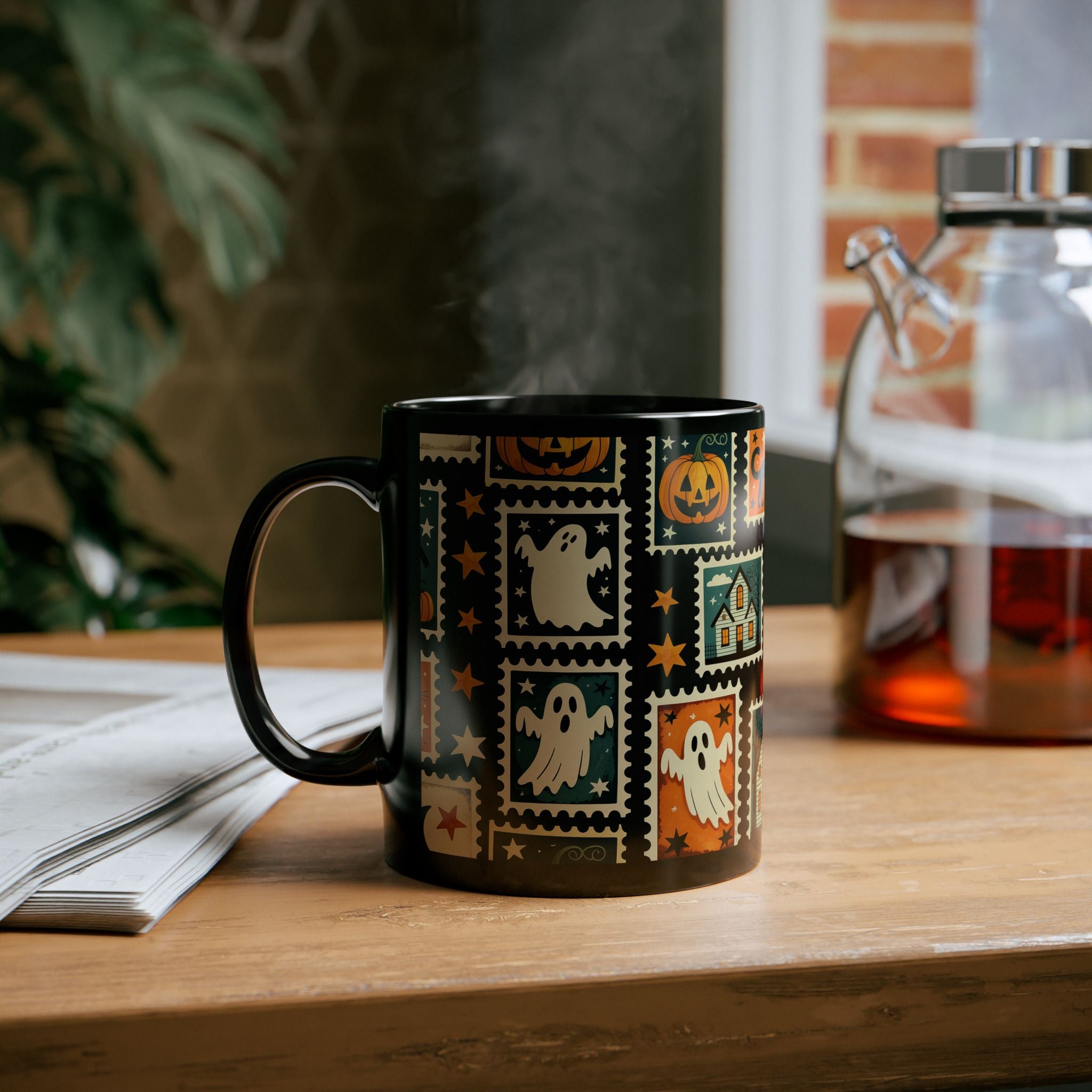 Black mug with Halloween-themed design on a wooden table