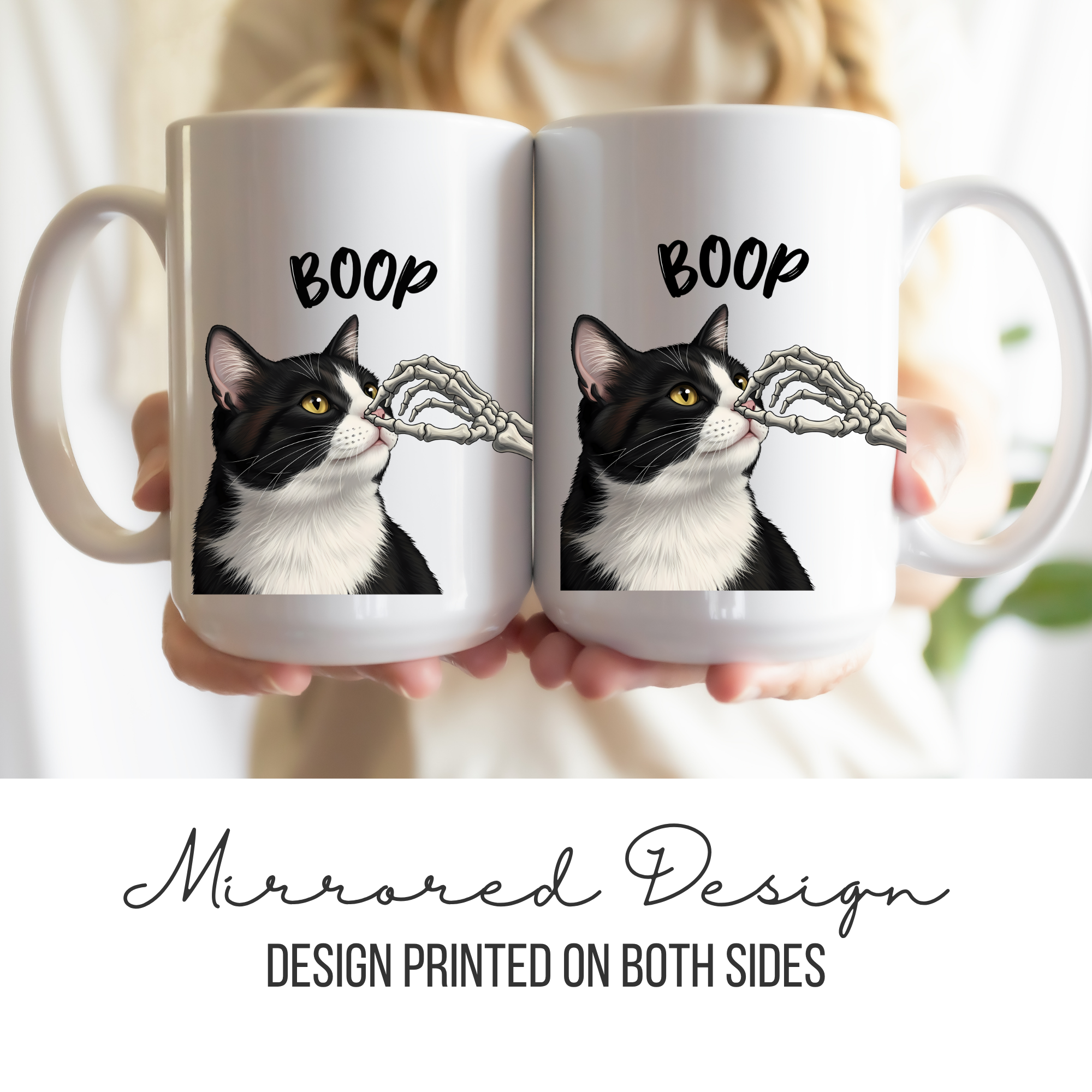 Two white mugs with a black and white cat design and 'BOOP' text, held together.