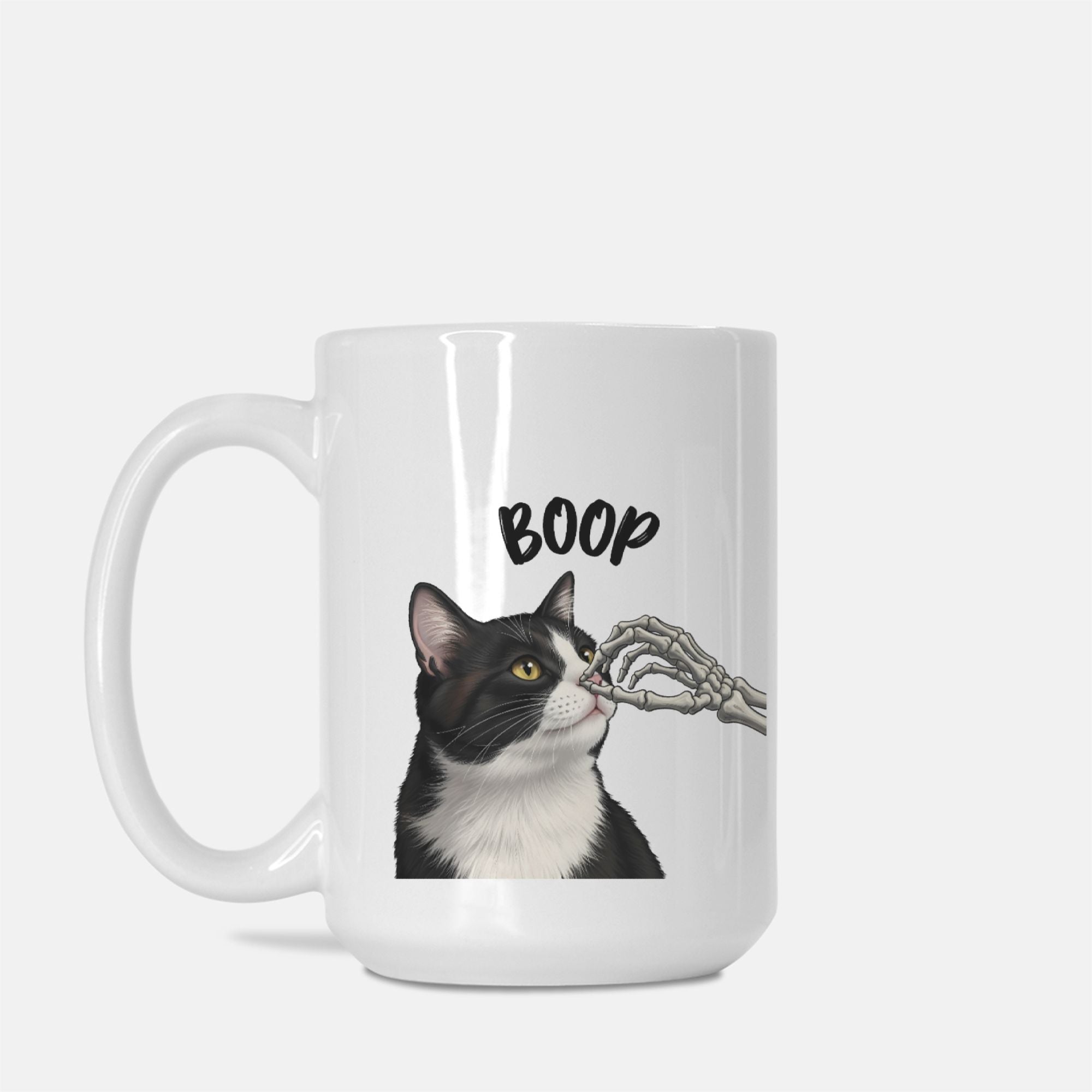Mug with a graphic of a cat and text 'BOOP' on a white background