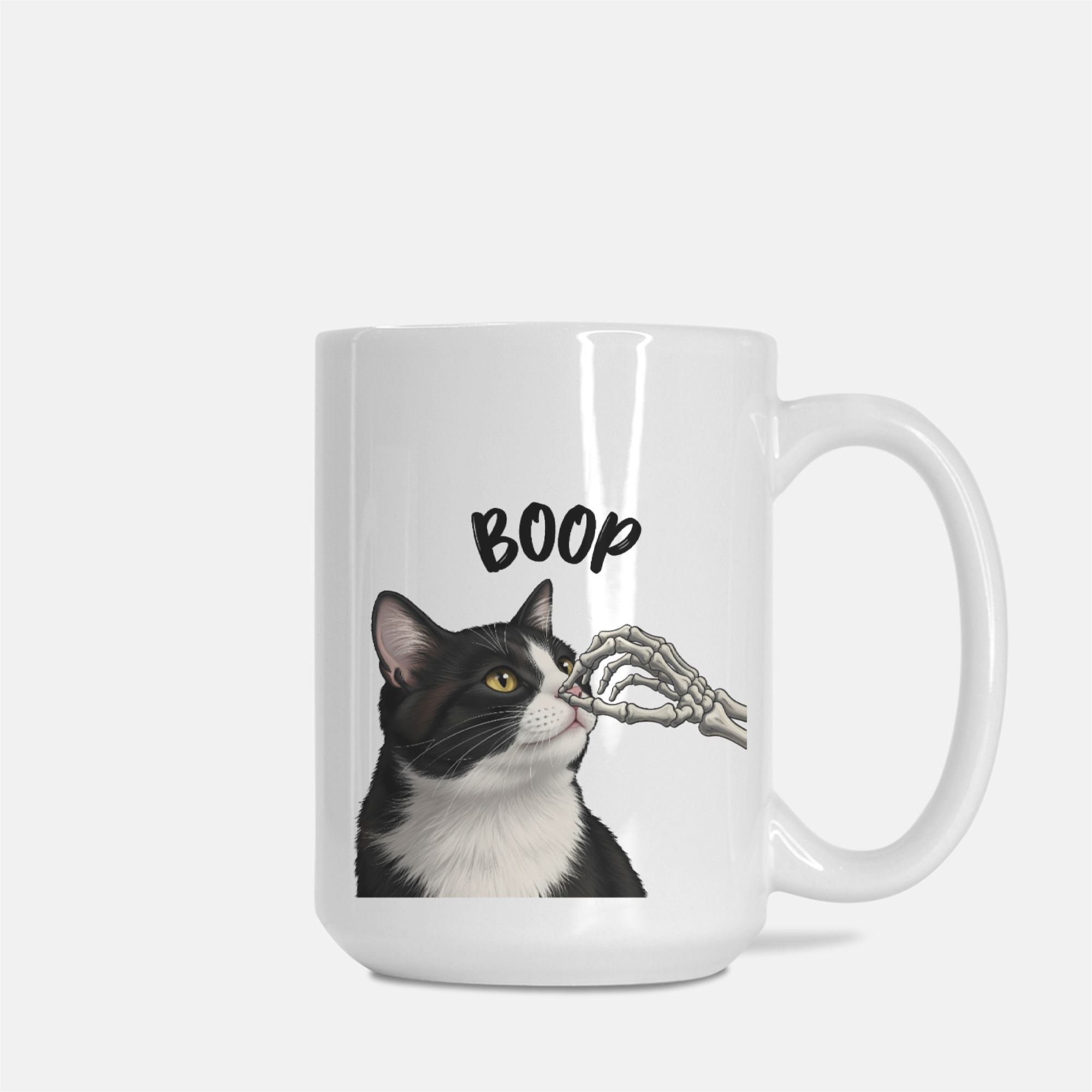 White mug with a black and white cat illustration and 'BOOP' text on a white background