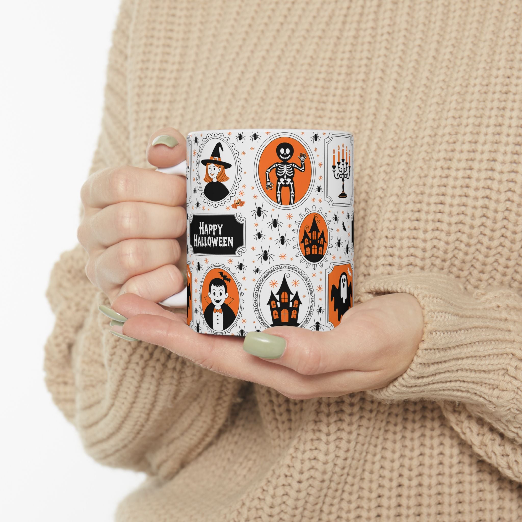 Person holding a mug with Halloween-themed design