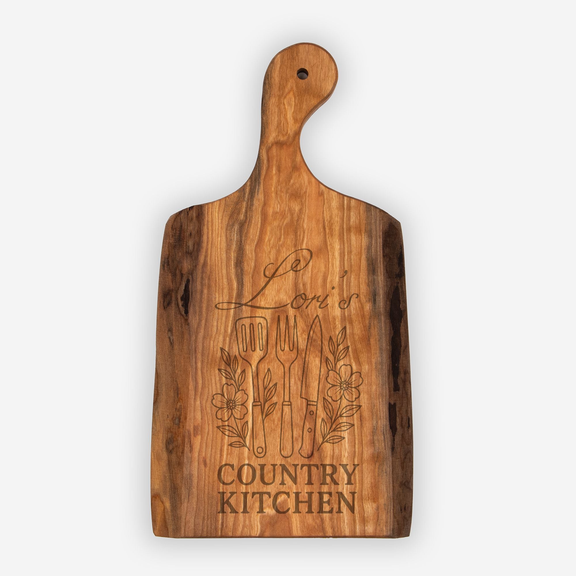 Wooden cutting board with engraved text and utensils on a white background