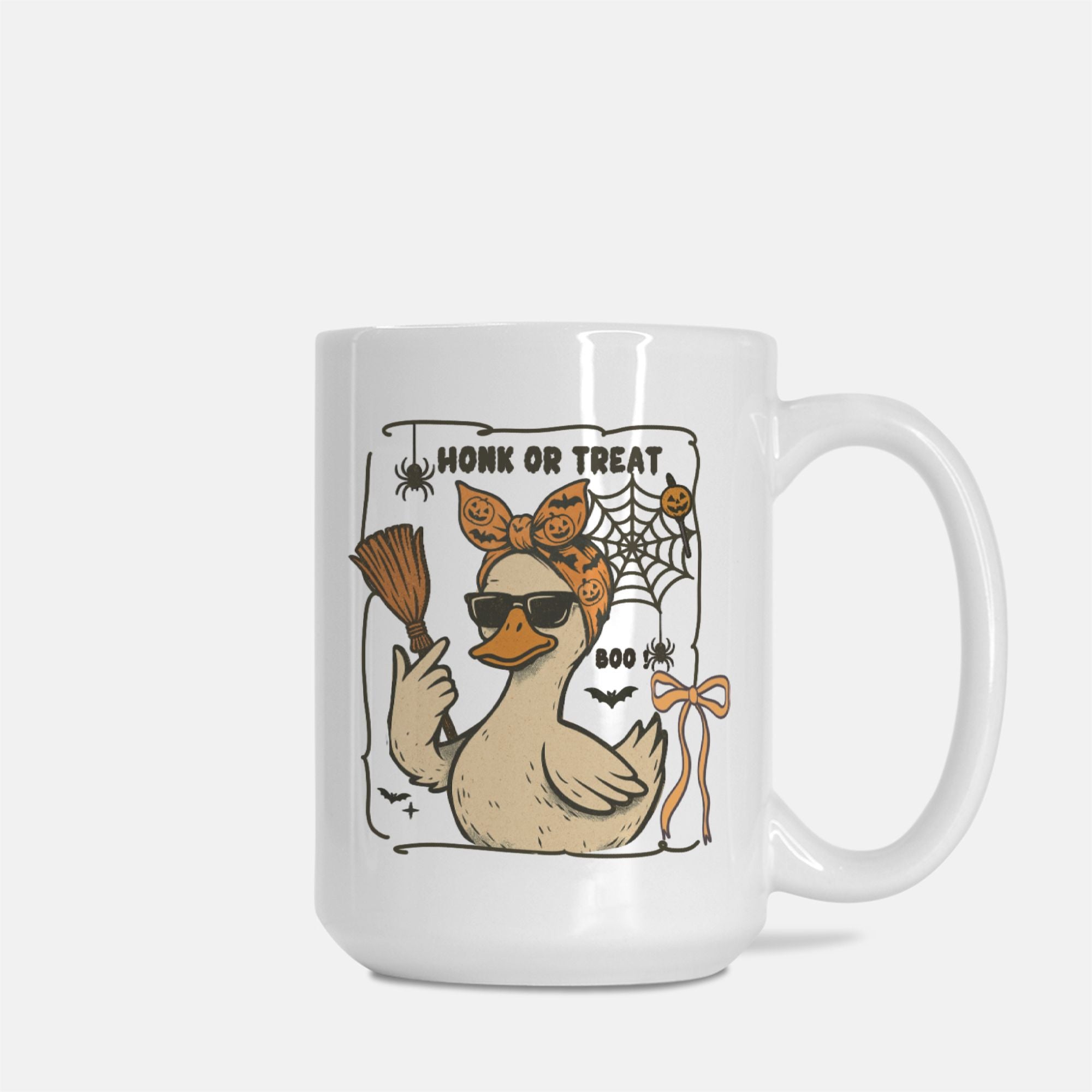 Mug with a Halloween-themed design featuring a duck, broom, and text on a white background