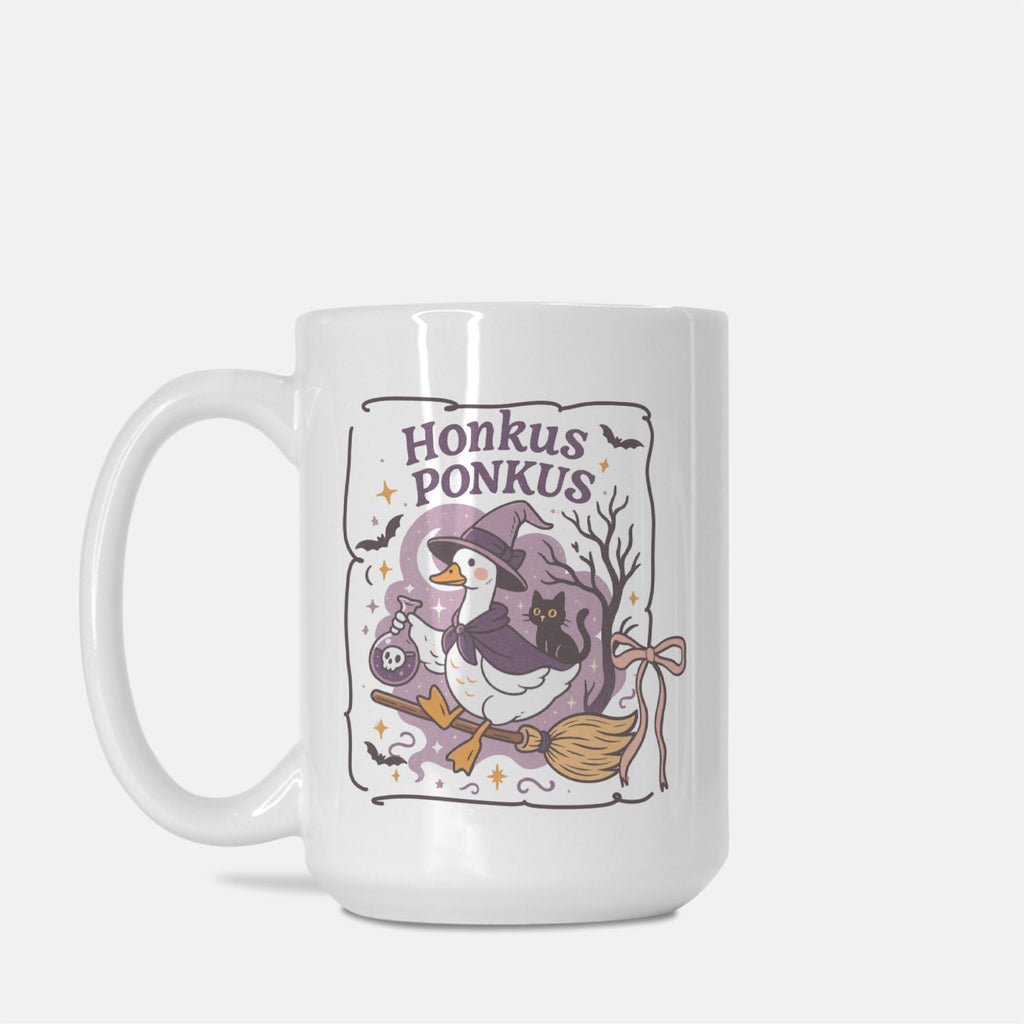 White mug with a witch-themed design and 'Honkus Ponkus' text on a white background