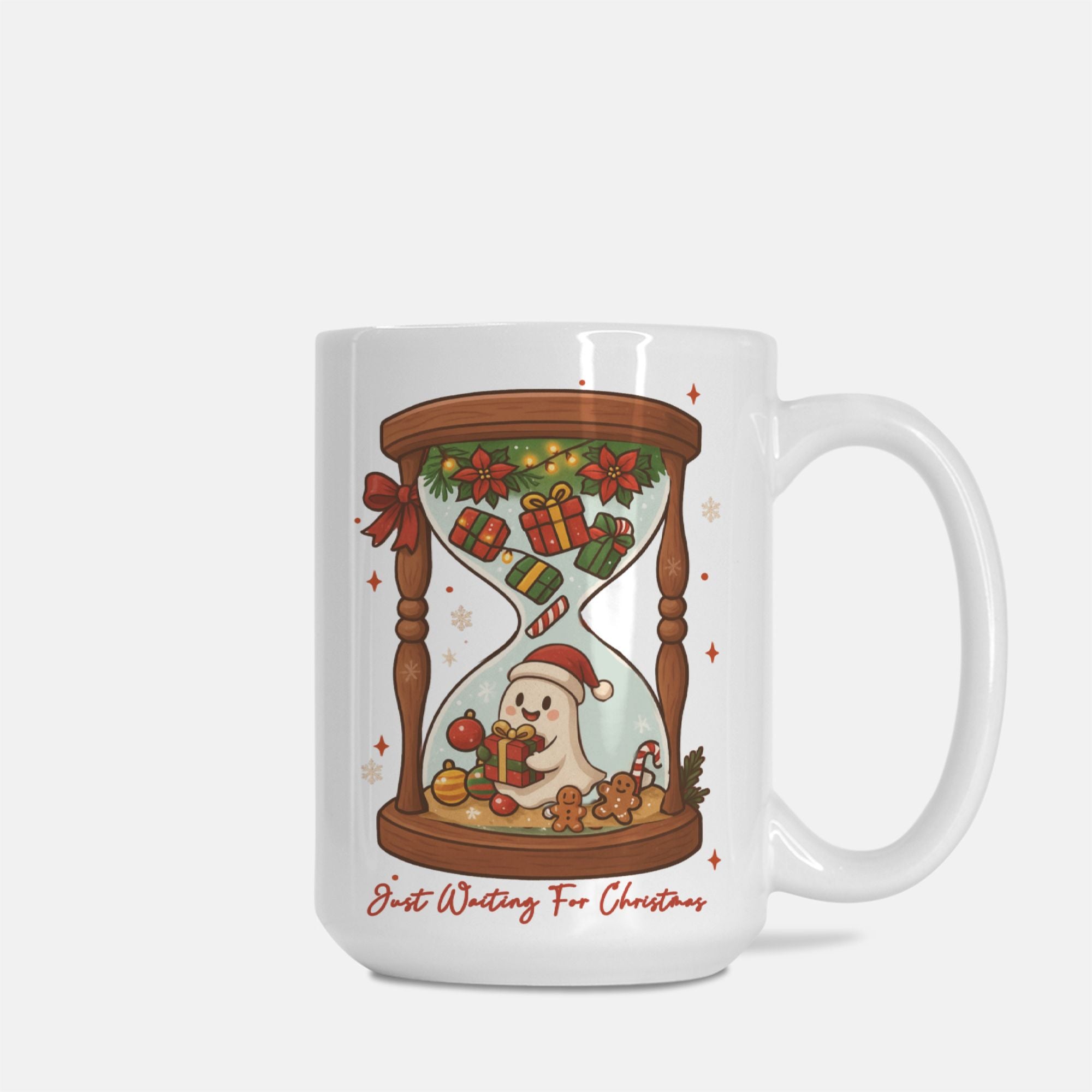 White mug with a Christmas-themed design featuring a ghost in a Santa hat and gift, with text 'Just Waiting For Christmas'.