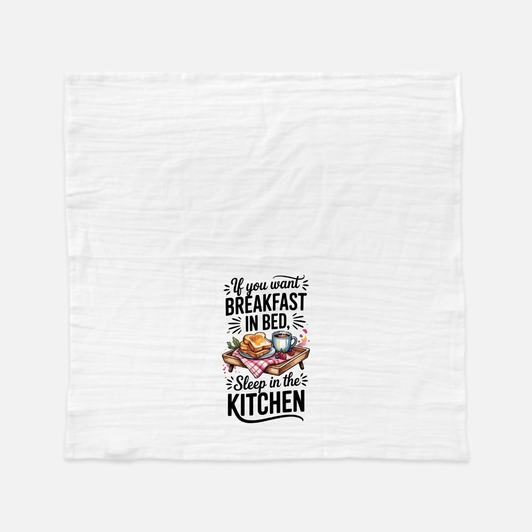 White towel with humorous kitchen-themed text and graphics on a white background