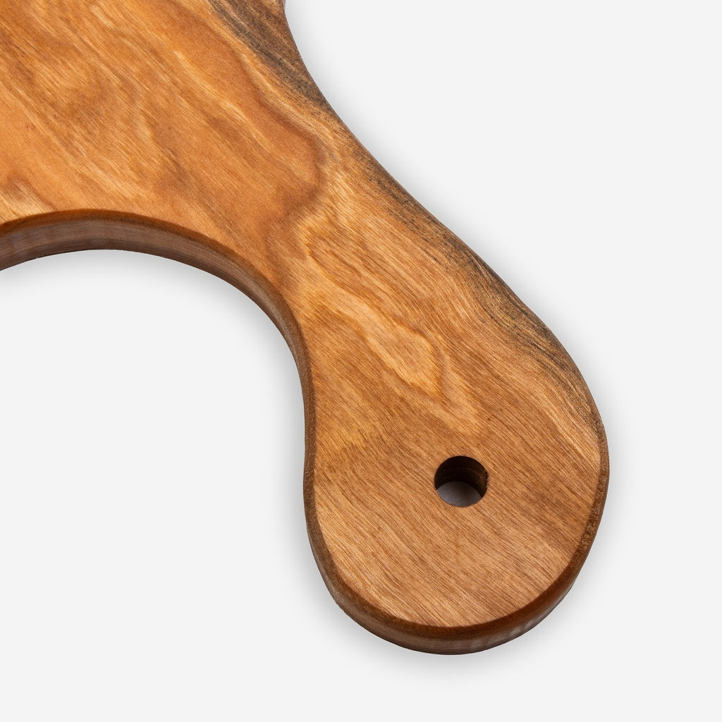 Cherry Wood charcuterie serving board  handle close up on a white background