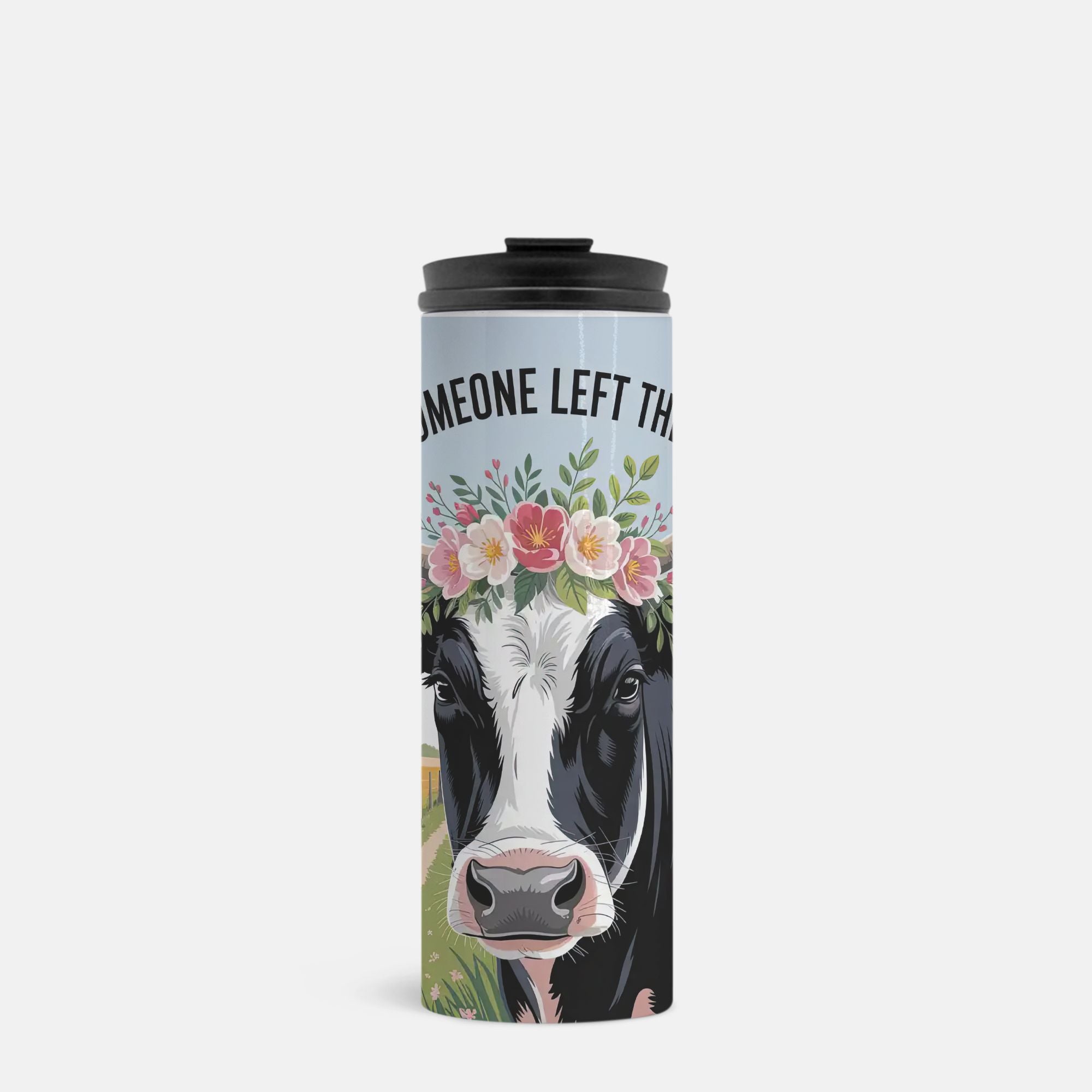 Travel mug with a cow illustration and floral crown on a light blue background