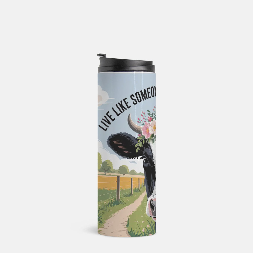 Tumbler with cow design and 'Live Like Someone' text on a white background