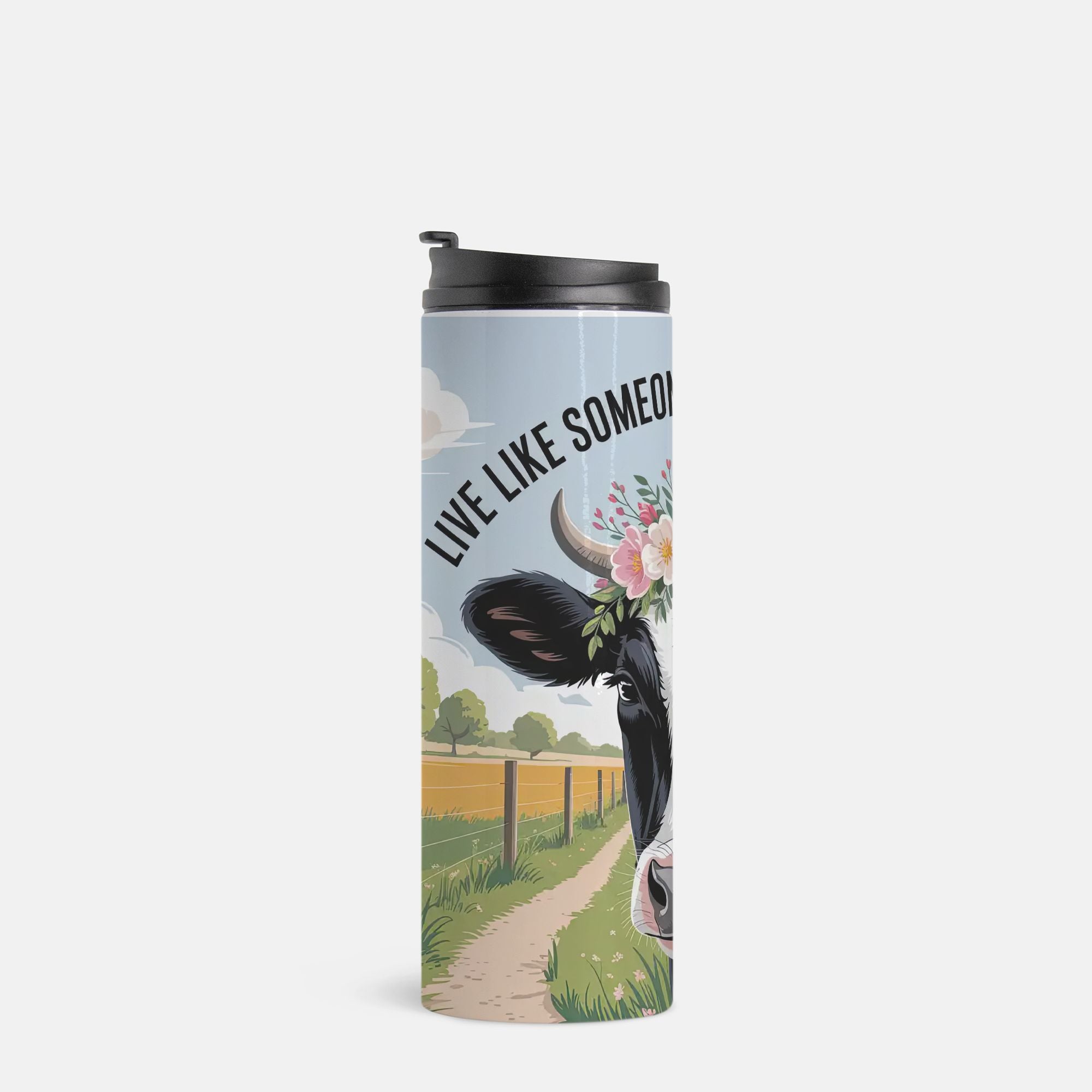 Tumbler with cow design and 'Live Like Someone' text on a white background