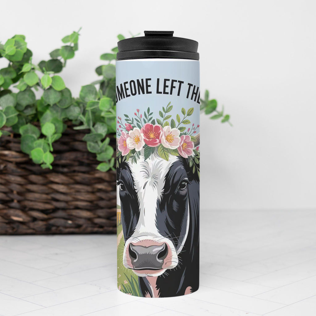 Tumbler with a cow design and floral crown on a white background