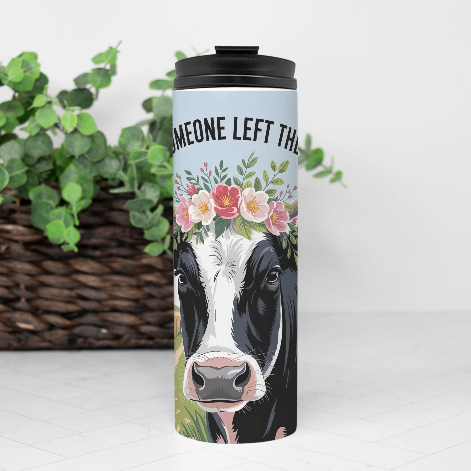 Tumbler with a cow design and floral crown on a white background