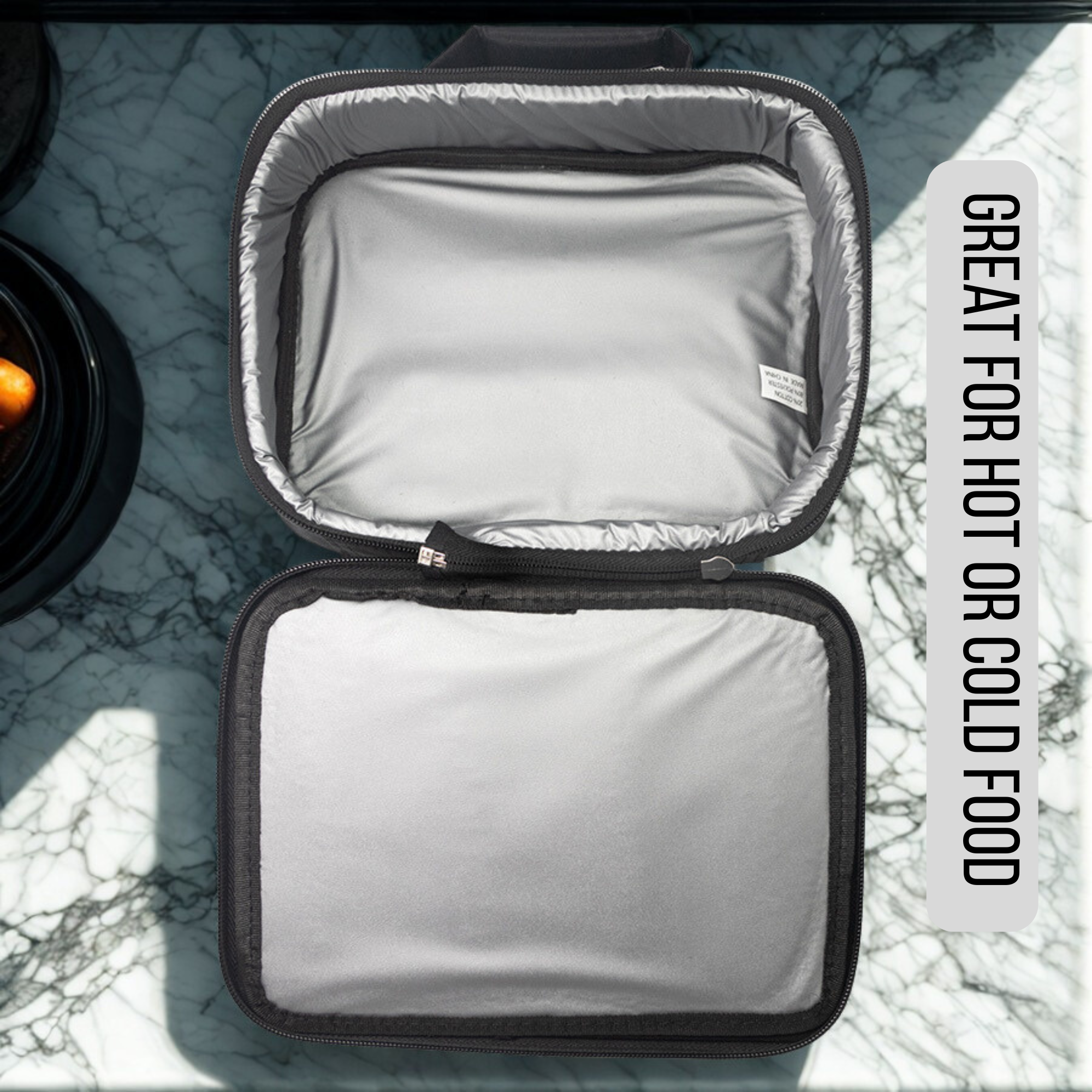 Insulated food container with text 'Great for hot or cold food' on a marble surface
