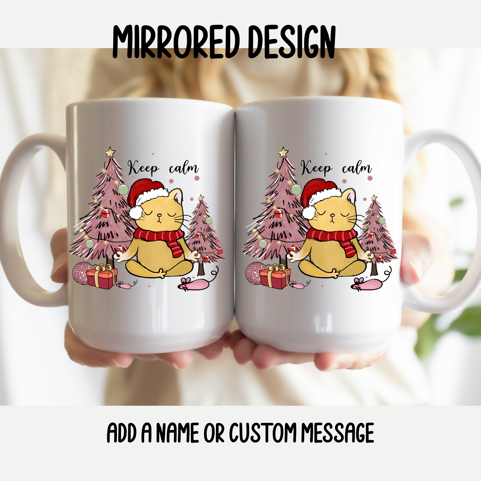 Two mugs with a mirrored design of a cat in a Santa hat and Christmas trees, held together.