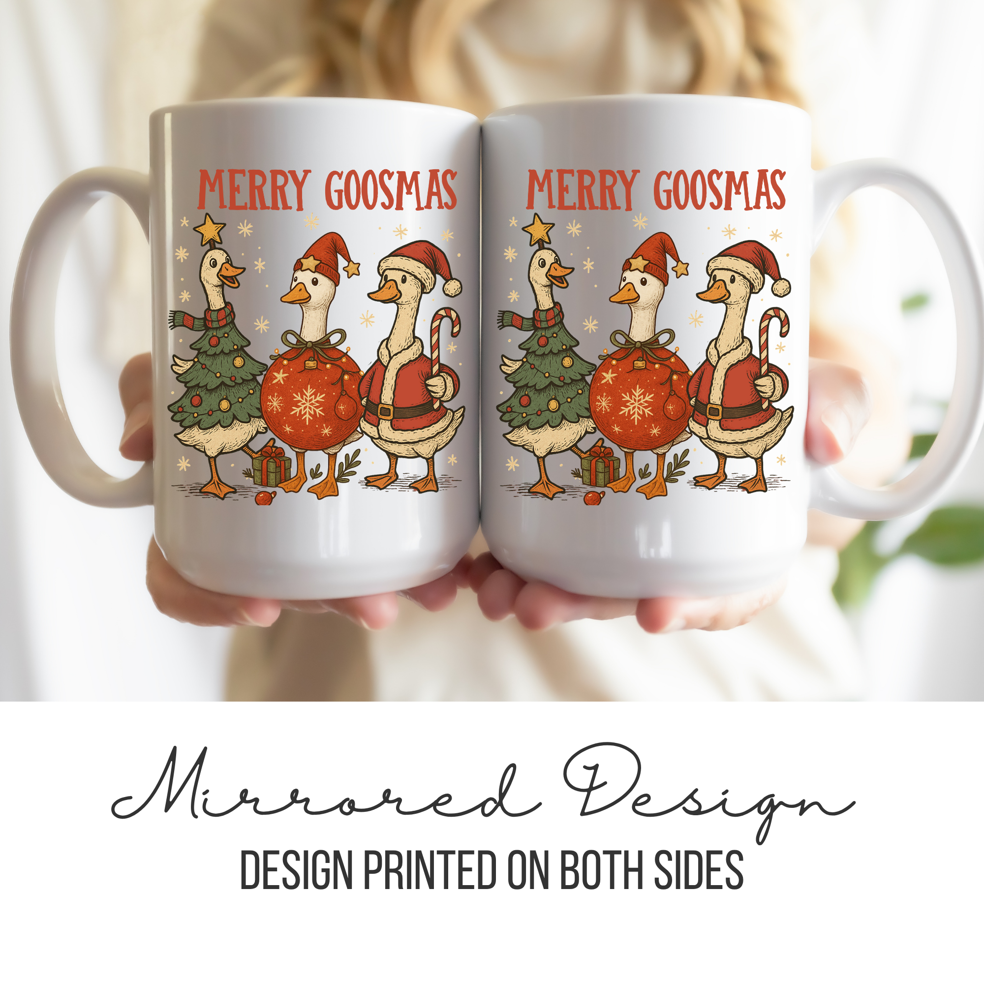Two white mugs with a Christmas design of geese and text 'Merry Goosmas' held together.